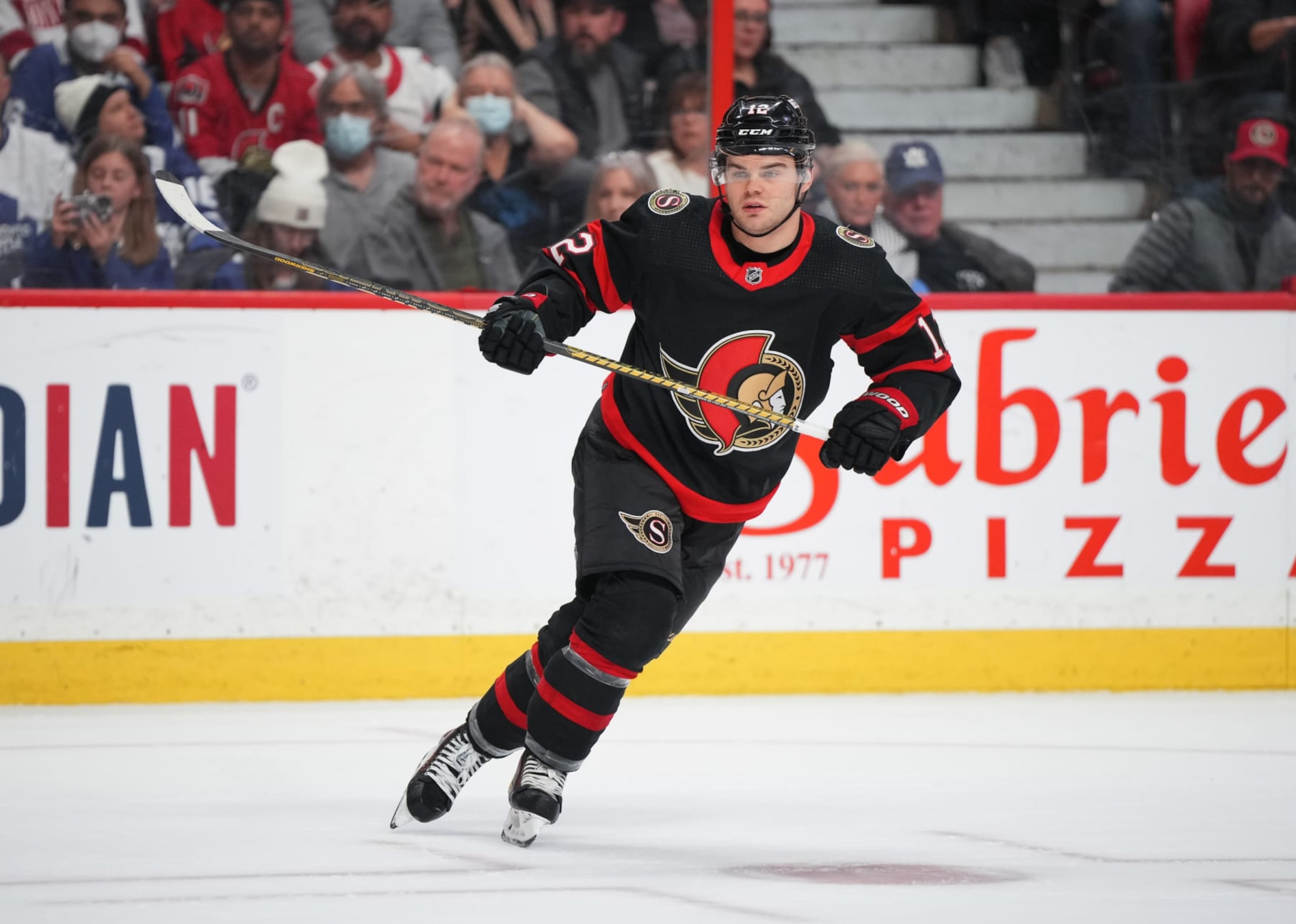 OTTAWA, CANADA - APRIL 1:  Alex DeBrincat #12 of the Ottawa Senators skates against the Toronto Maple Leafs at Canadian Tire Centre on April 1, 2023 in Ottawa, Ontario, Canada.  (Photo by André Ringuette/NHLI via Getty Images)