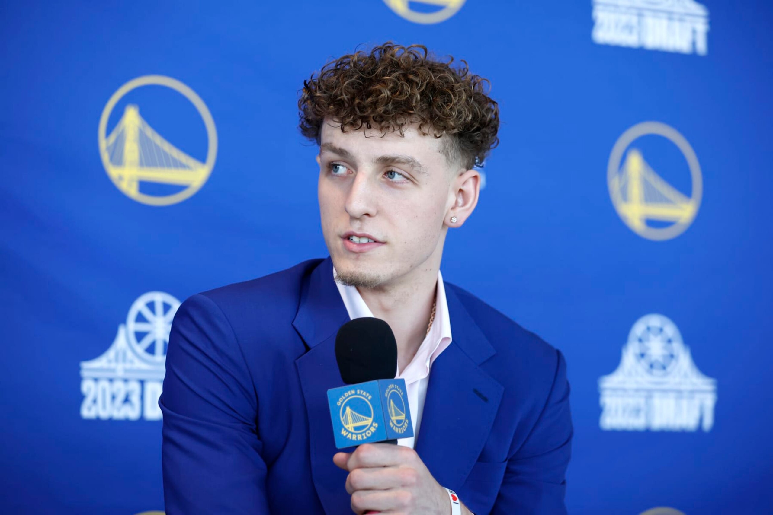 SAN FRANCISCO, CA - JUNE 23: Golden State Warriors' Brandin Podziemski speaks to the media during a press conference on June 23, 2023 at Chase Center in San Francisco, California. NOTE TO USER: User expressly acknowledges and agrees that, by downloading and or using this photograph, user is consenting to the terms and conditions of Getty Images License Agreement. Mandatory Copyright Notice: Copyright 2023 NBAE (Photo by Jed Jacobsohn/NBAE via Getty Images) SAN FRANCISCO, CA - JUNE 23: Golden State Warriors' Brandin Podziemski speaks to the media during a press conference on June 23, 2023 at Chase Center in San Francisco, California. NOTE TO USER: User expressly acknowledges and agrees that, by downloading and or using this photograph, user is consenting to the terms and conditions of Getty Images License Agreement. Mandatory Copyright Notice: Copyright 2023 NBAE (Photo by Jed Jacobsohn/NBAE via Getty Images)