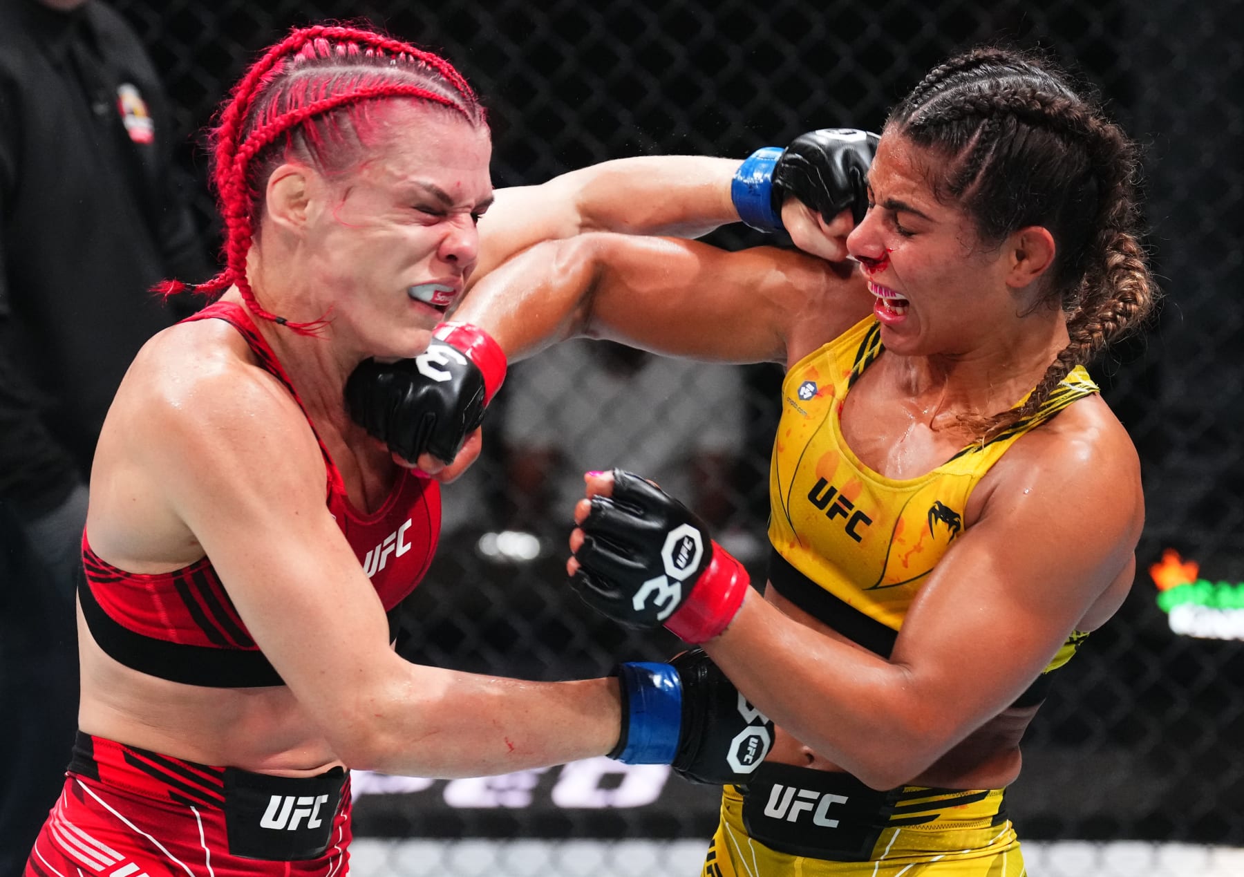 JACKSONVILLE, FLORIDA - JUNE 24:  (L-R) Gillian Robertson of Canada exchanges punches Tabatha Ricci of Brazil in their women's strawweight fight during the UFC Fight Night event at Vystar Veterans Memorial Arena on June 24, 2023 in Jacksonville, Florida. (Photo by Josh Hedges/Zuffa LLC)