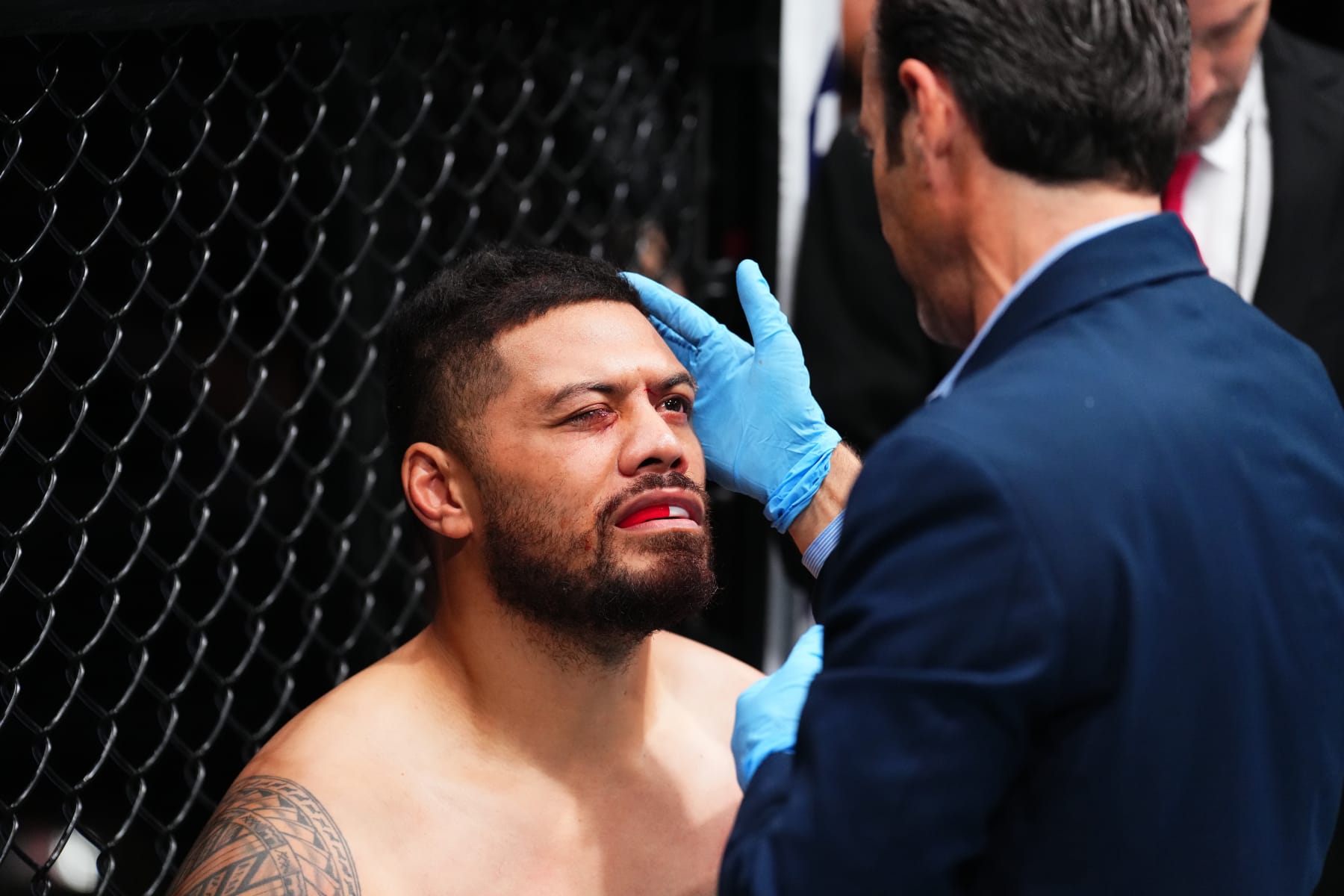 JACKSONVILLE, FLORIDA - JUNE 24:  Justin Tafa of New Zealand reacts to to accidental eye poke form Austen Lane in their heavyweight fight during the UFC Fight Night event at Vystar Veterans Memorial Arena on June 24, 2023 in Jacksonville, Florida. (Photo by Josh Hedges/Zuffa LLC)