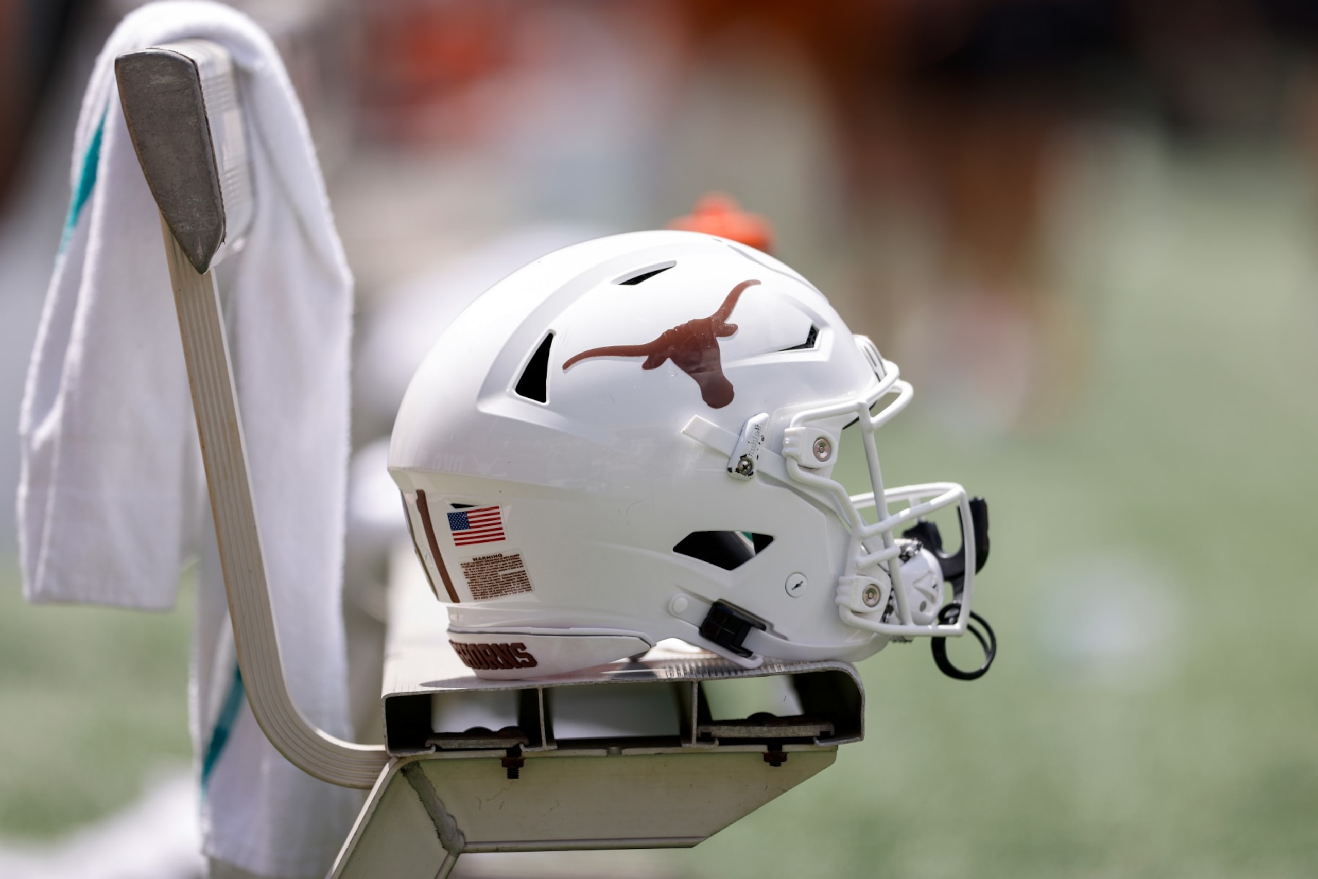 AUSTIN, TEXAS - APRIL 15: A Texas Longhorns football helmet is seen on the bench during the Texas Football Orange-White Spring Football Game at Darrell K Royal-Texas Memorial Stadium on April 15, 2023 in Austin, Texas. (Photo by Tim Warner/Getty Images) AUSTIN, TEXAS - APRIL 15: A Texas Longhorns football helmet is seen on the bench during the Texas Football Orange-White Spring Football Game at Darrell K Royal-Texas Memorial Stadium on April 15, 2023 in Austin, Texas. (Photo by Tim Warner/Getty Images)