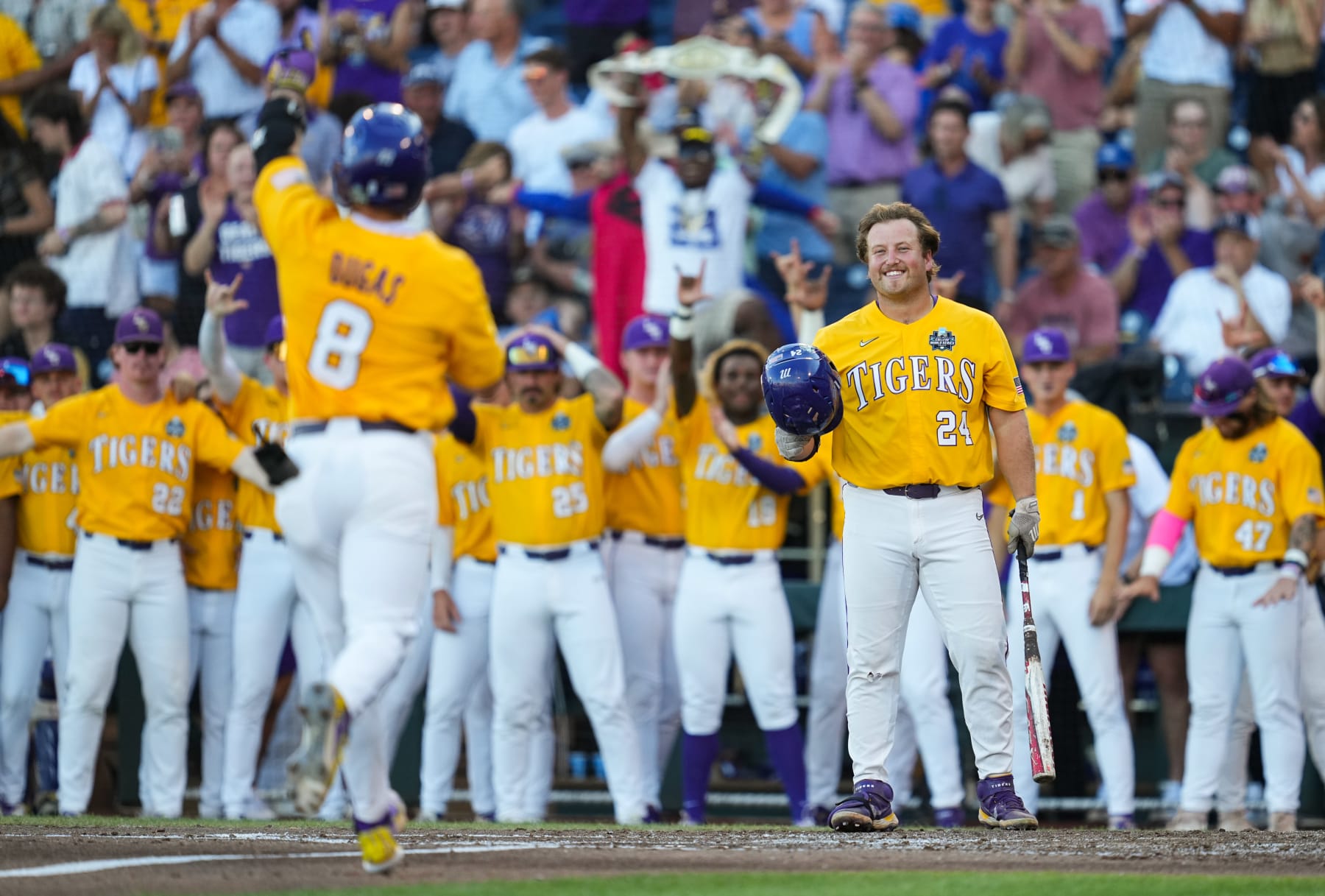 OMAHA, NEBRASKA - JUNE 24: Cade Beloso #24 of the LSU Tigers waits at home plate after a home run by Gavin Dugas #8 during the third inning of Game 1 of the NCAA College World Series baseball finals against the Florida Gators at Charles Schwab Field on June 24, 2023 in Omaha, Nebraska. (Photo by Jay Biggerstaff/Getty Images)