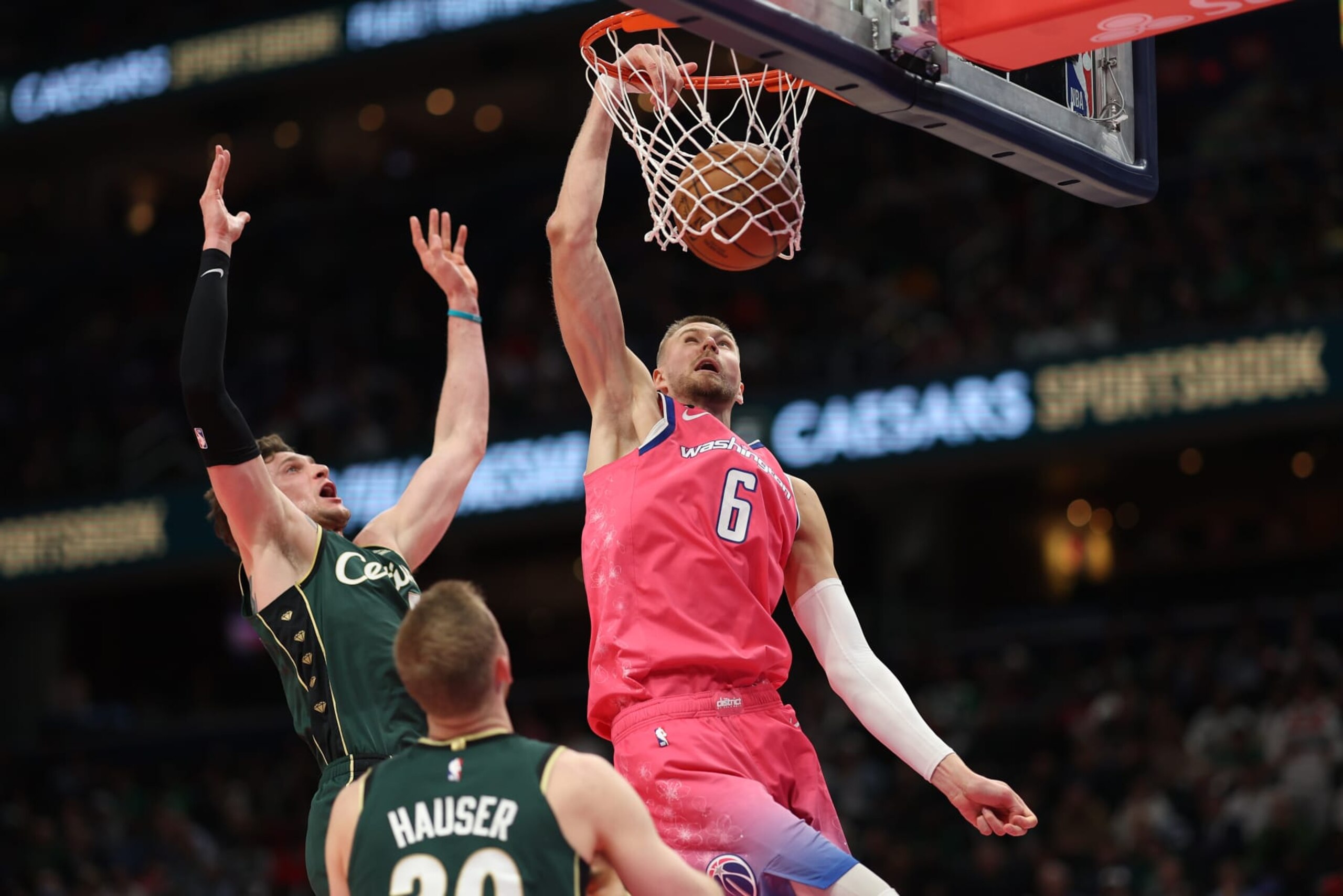 WASHINGTON, DC - MARCH 28: Kristaps Porzingis #6 of the Washington Wizards dunks against the Boston Celtics during the second half at Capital One Arena on March 28, 2023 in Washington, DC. NOTE TO USER: User expressly acknowledges and agrees that, by downloading and or using this photograph, User is consenting to the terms and conditions of the Getty Images License Agreement. (Photo by Patrick Smith/Getty Images)
