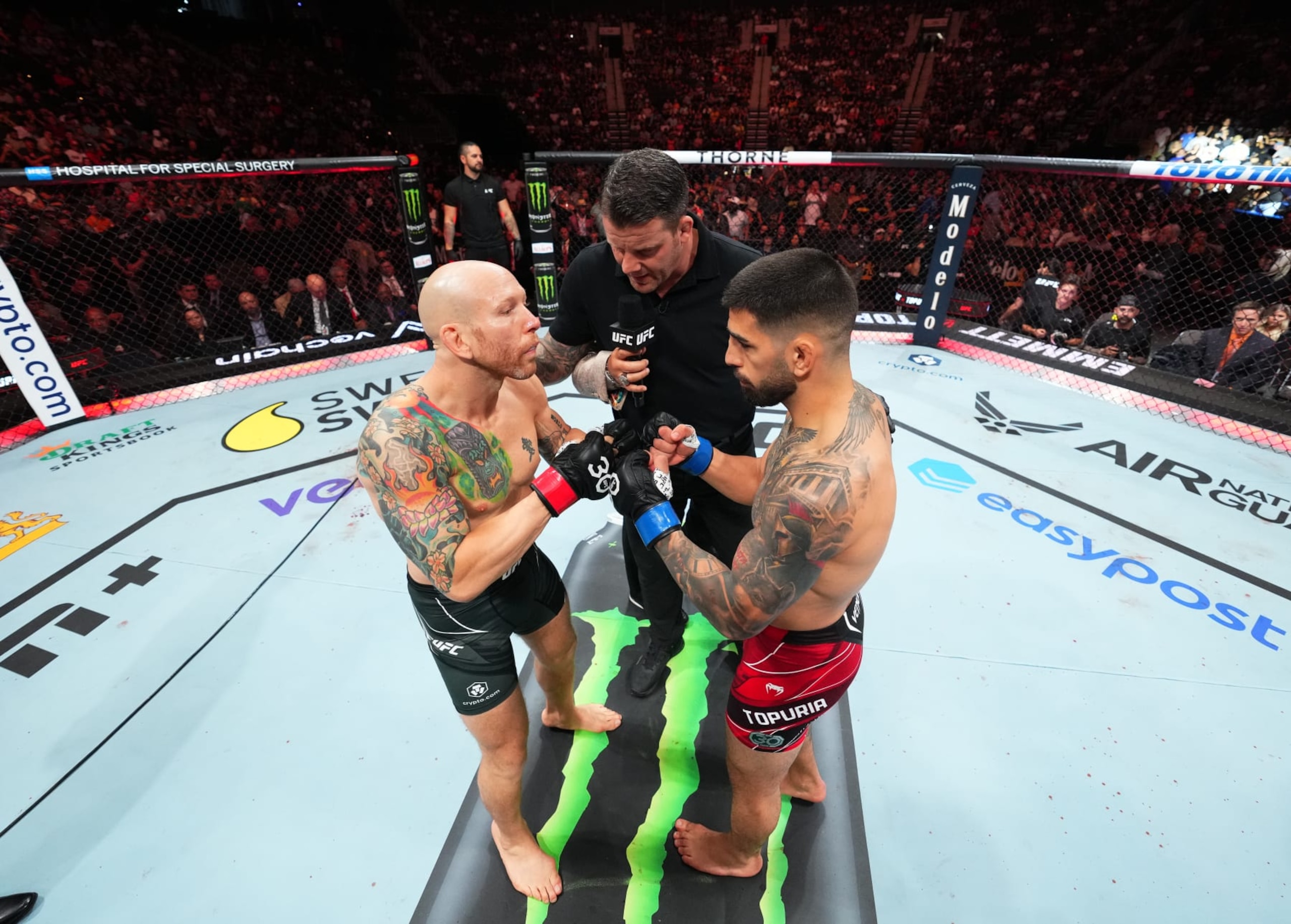 JACKSONVILLE, FLORIDA - JUNE 24:  (L-R) Josh Emmett touches gloves with Ilia Topuria of Germanyin their featherweight fight during the UFC Fight Night event at Vystar Veterans Memorial Arena on June 24, 2023 in Jacksonville, Florida. (Photo by Josh Hedges/Zuffa LLC)