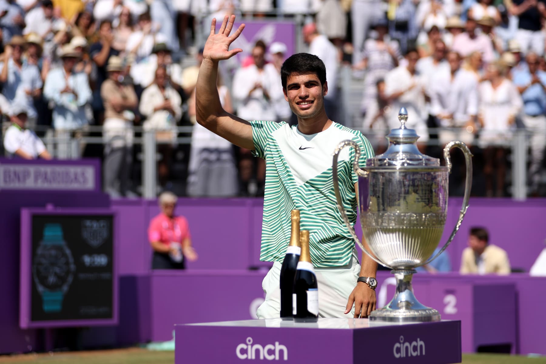 LONDON, ENGLAND - JUNE 25: Carlos Alcaraz of Spain prepares to receive his winners trophy after victory against Alex De Minaur of Australia in the Men's Singles Final match on Day Seven of the cinch Championships at The Queen's Club on June 25, 2023 in London, England. (Photo by Clive Brunskill/Getty Images)