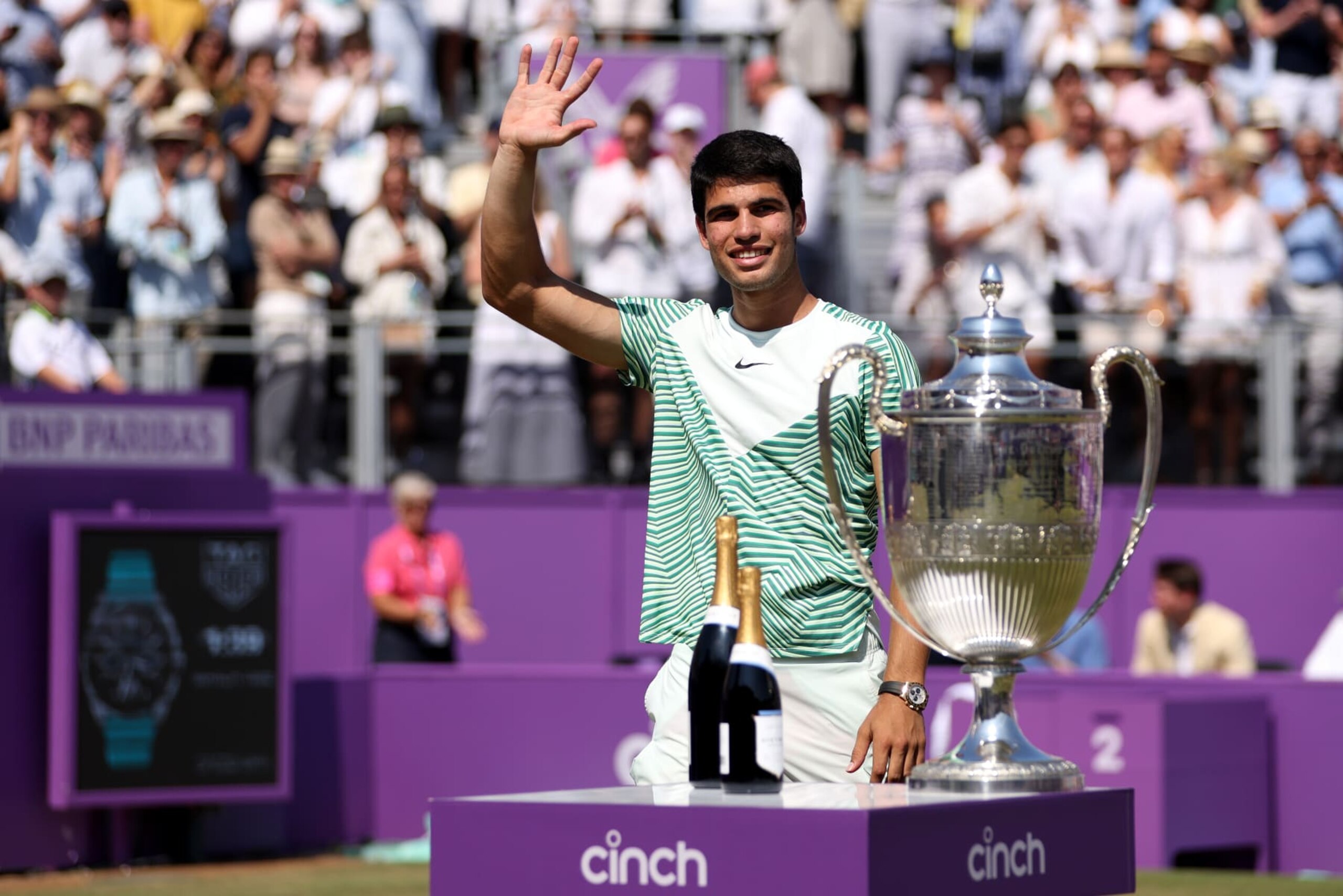 LONDON, ENGLAND - JUNE 25: Carlos Alcaraz of Spain prepares to receive his winners trophy after victory against Alex De Minaur of Australia in the Men's Singles Final match on Day Seven of the cinch Championships at The Queen's Club on June 25, 2023 in London, England. (Photo by Clive Brunskill/Getty Images)