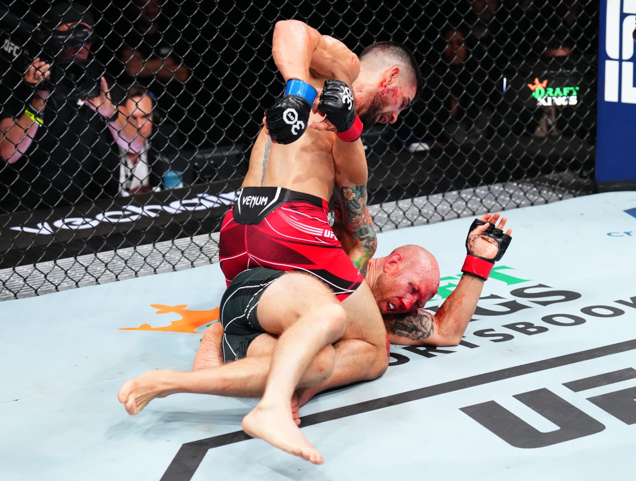 JACKSONVILLE, FLORIDA - JUNE 24:  (L-R) Ilia Topuria of Germany punches Josh Emmett in their featherweight fight during the UFC Fight Night event at Vystar Veterans Memorial Arena on June 24, 2023 in Jacksonville, Florida. (Photo by Josh Hedges/Zuffa LLC)
