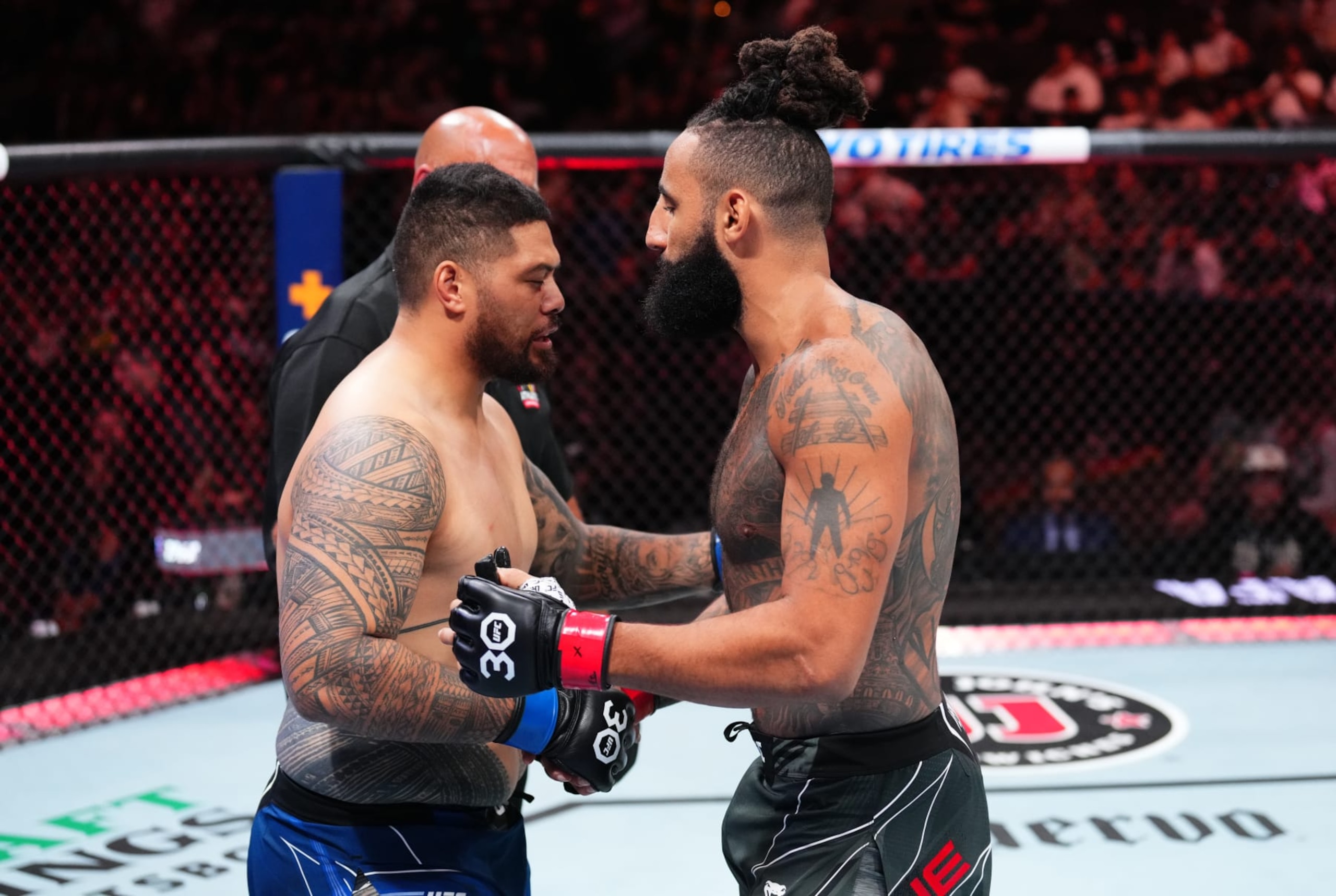 JACKSONVILLE, FLORIDA - JUNE 24:  (R-L) Austen Lane and Justin Tafa of New Zealand react to their No Contest decision in their heavyweight fight during the UFC Fight Night event at Vystar Veterans Memorial Arena on June 24, 2023 in Jacksonville, Florida. (Photo by Josh Hedges/Zuffa LLC)