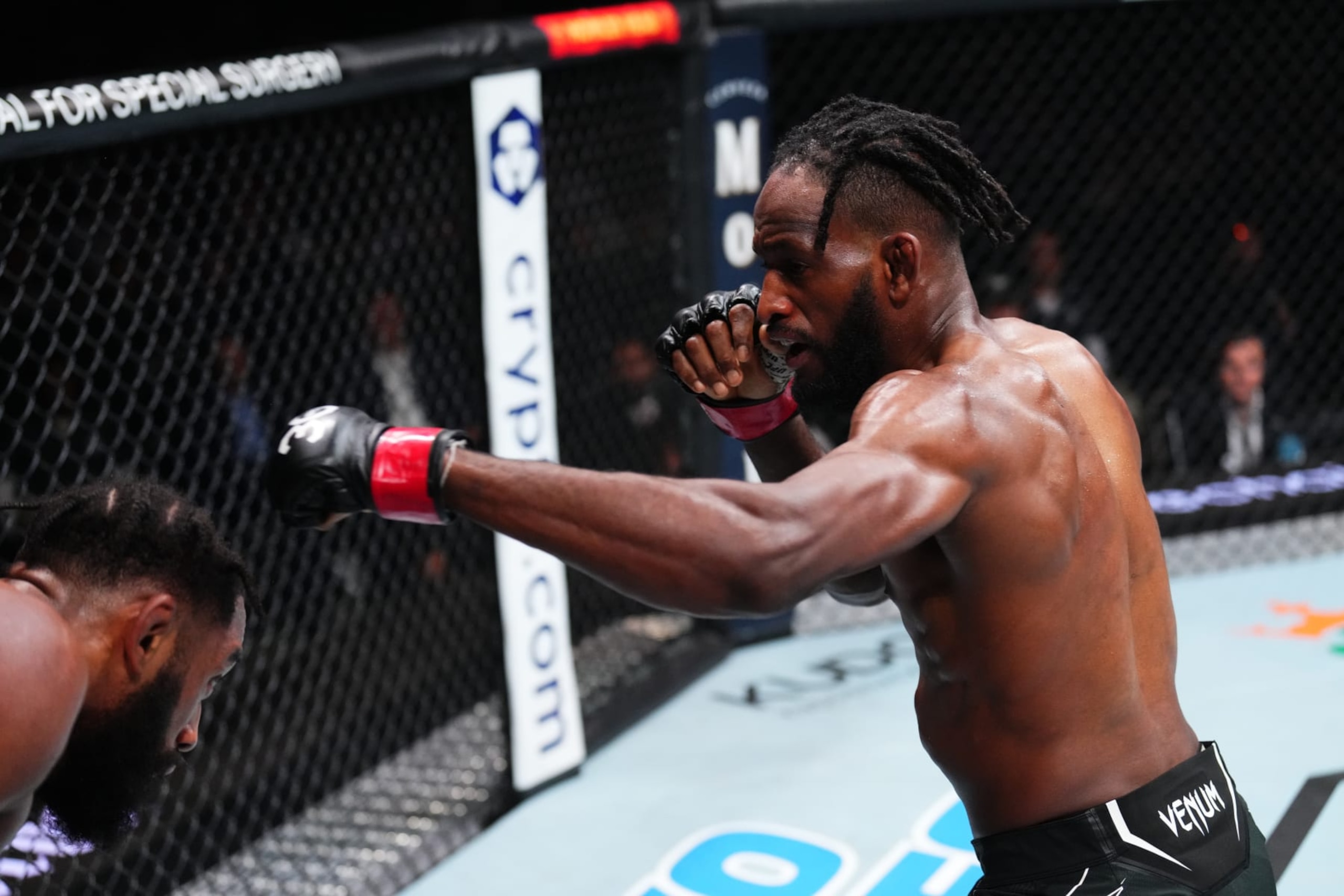JACKSONVILLE, FLORIDA - JUNE 24:  (R-L) Neil Magny punches Phil Rowe in their welterweight fight during the UFC Fight Night event at Vystar Veterans Memorial Arena on June 24, 2023 in Jacksonville, Florida. (Photo by Josh Hedges/Zuffa LLC)
