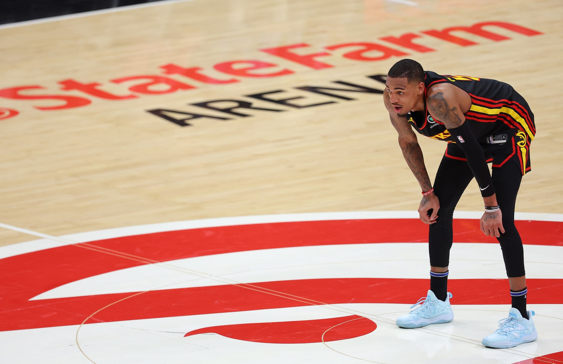 ATLANTA, GEORGIA - APRIL 23:  Dejounte Murray #5 of the Atlanta Hawks reacts against the Boston Celtics in the final seconds of the fourth quarter of Game Four of the Eastern Conference First Round Playoffs at State Farm Arena on April 23, 2023 in Atlanta, Georgia. NOTE TO USER: User expressly acknowledges and agrees that, by downloading and or using this photograph, User is consenting to the terms and conditions of the Getty Images License Agreement.  (Photo by Kevin C. Cox/Getty Images)