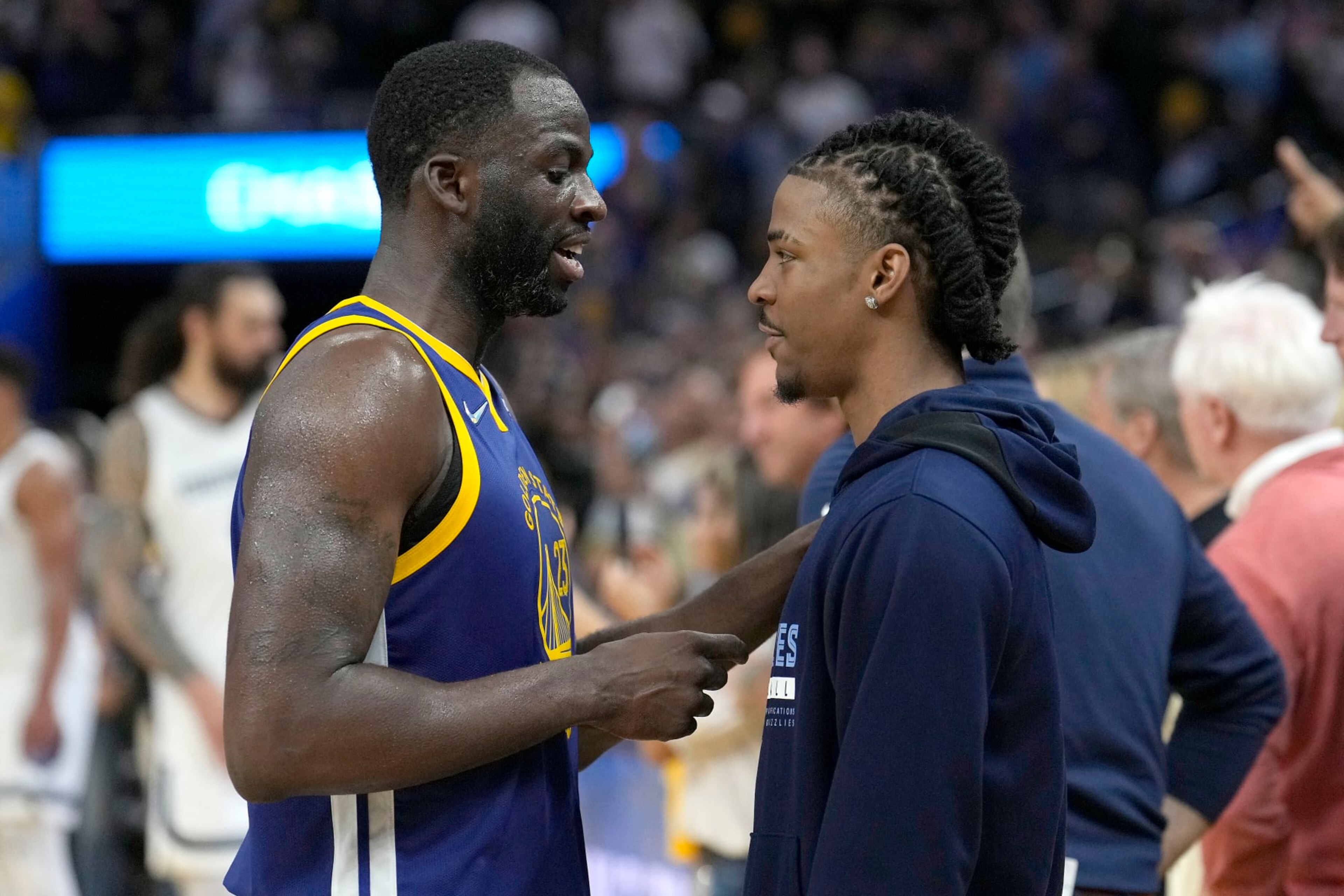 Golden State Warriors forward Draymond Green, left, talks with Memphis Grizzlies' Ja Morant after Game 6 of an NBA basketball Western Conference playoff semifinal in San Francisco, Friday, May 13, 2022. The Warriors won 110-96 and advanced to the conference finals. (AP Photo/Tony Avelar) Golden State Warriors forward Draymond Green, left, talks with Memphis Grizzlies' Ja Morant after Game 6 of an NBA basketball Western Conference playoff semifinal in San Francisco, Friday, May 13, 2022. The Warriors won 110-96 and advanced to the conference finals. (AP Photo/Tony Avelar)
