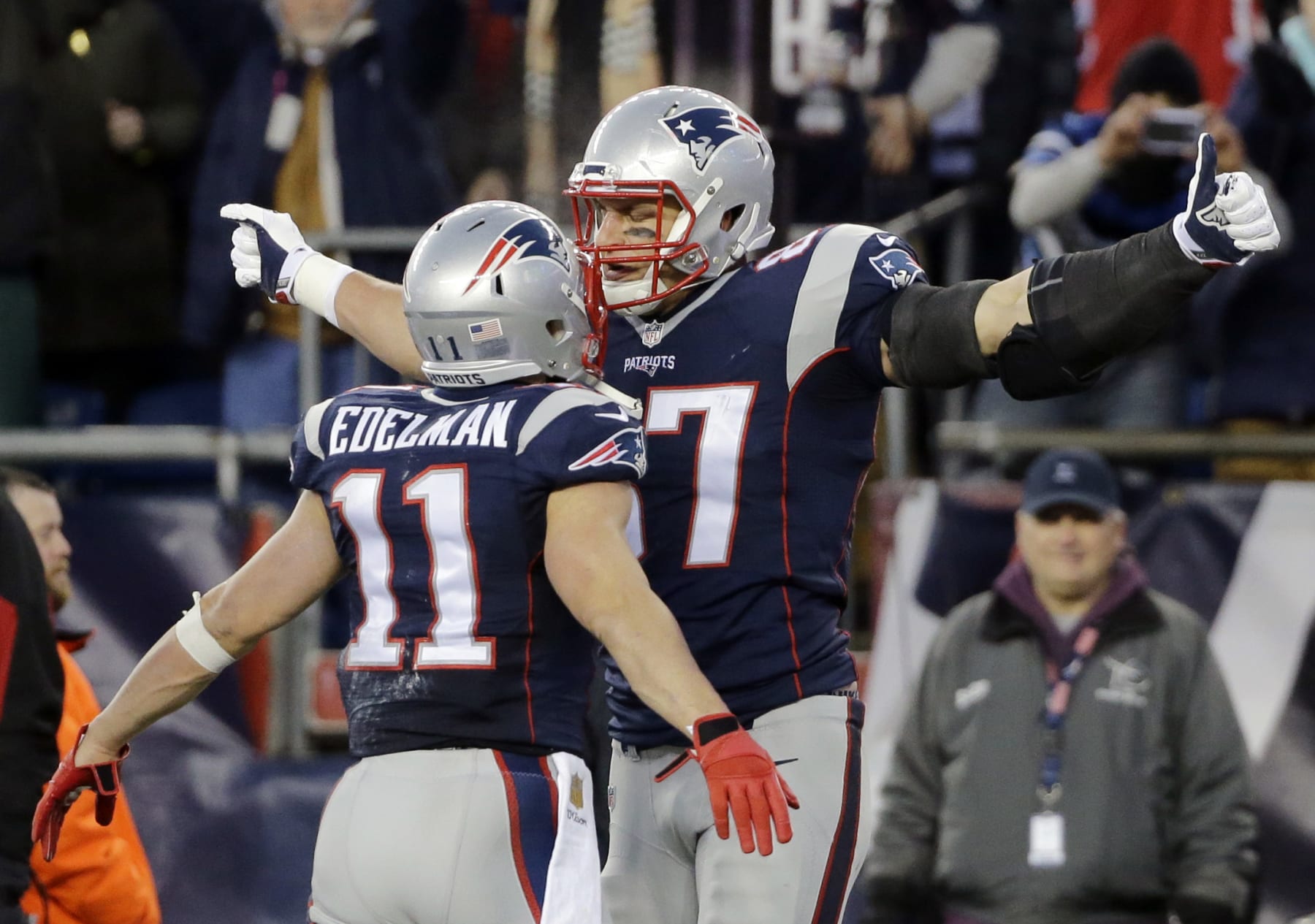 New England Patriots tight end Rob Gronkowski (87) celebrates his touchdown against the Kansas City Chiefs with teammate Julian Edelman (11) in the first half of an NFL divisional playoff football game, Saturday, Jan. 16, 2016, in Foxborough, Mass. (AP Photo/Elise Amendola)