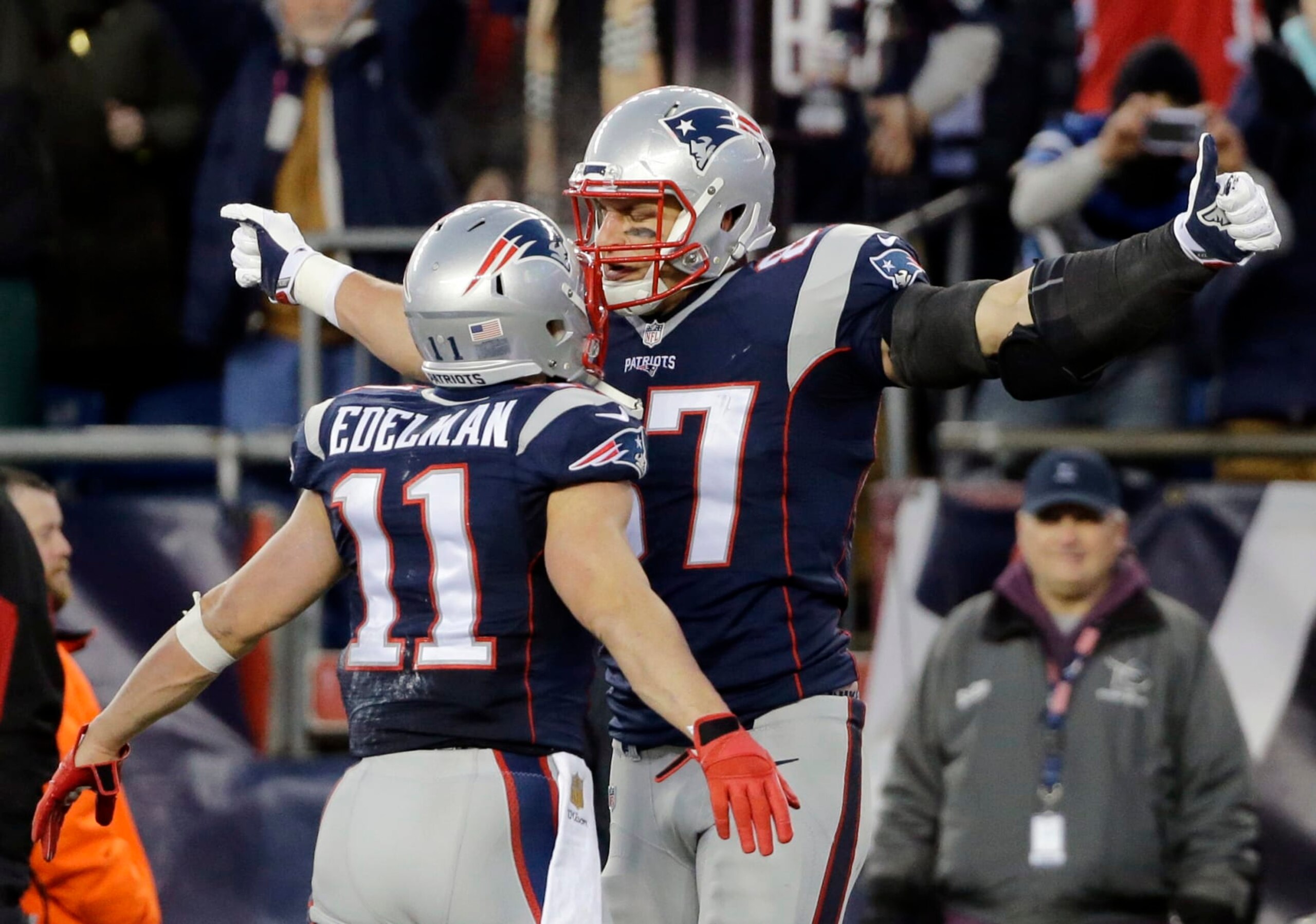 New England Patriots tight end Rob Gronkowski (87) celebrates his touchdown against the Kansas City Chiefs with teammate Julian Edelman (11) in the first half of an NFL divisional playoff football game, Saturday, Jan. 16, 2016, in Foxborough, Mass. (AP Photo/Elise Amendola)