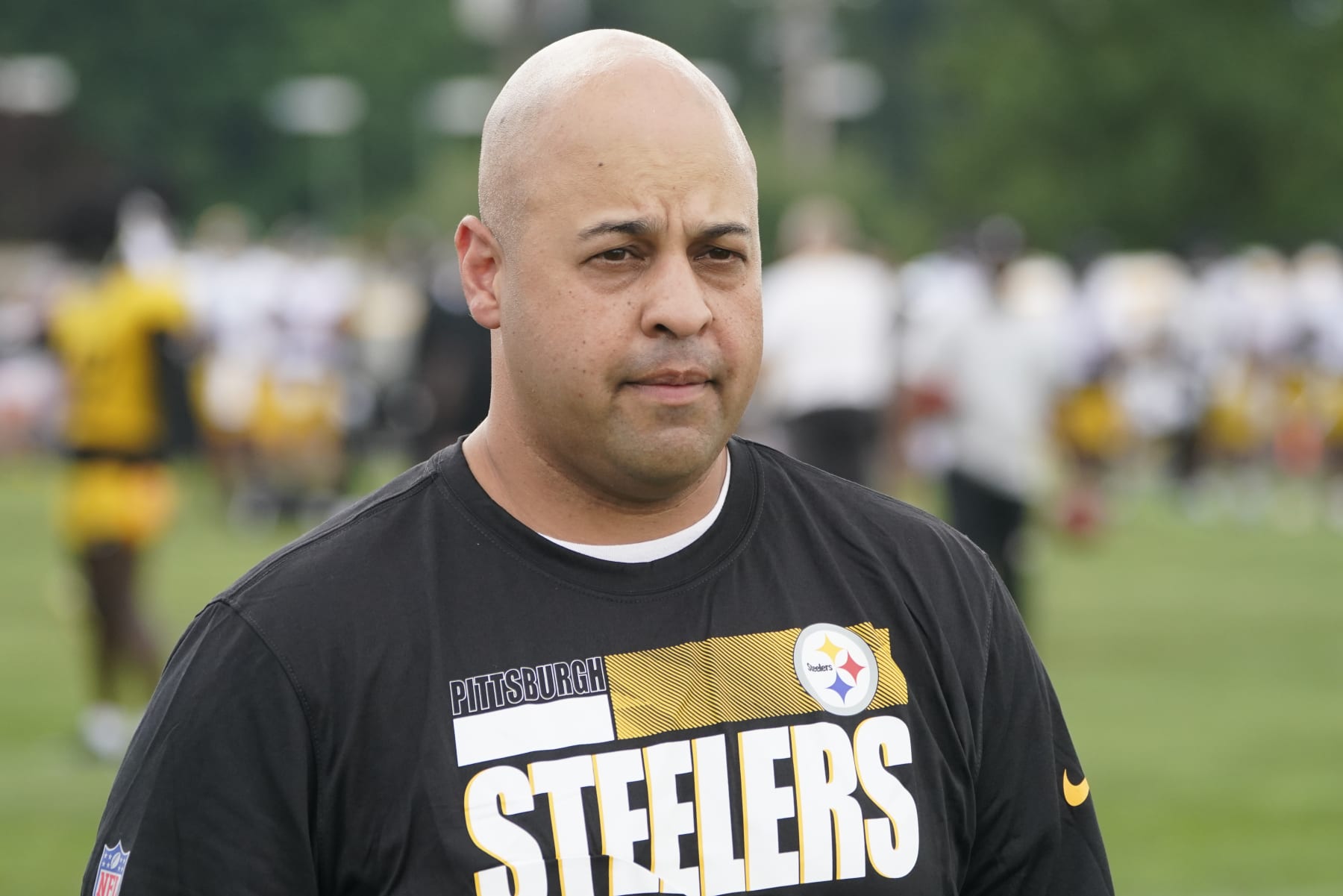Pittsburgh Steelers General Manager Omar Khan watches the team go through drills during practice at NFL football training camp in the Latrobe Memorial Stadium in Latrobe, Pa., Monday, Aug. 8, 2022. (AP Photo/Keith Srakocic)