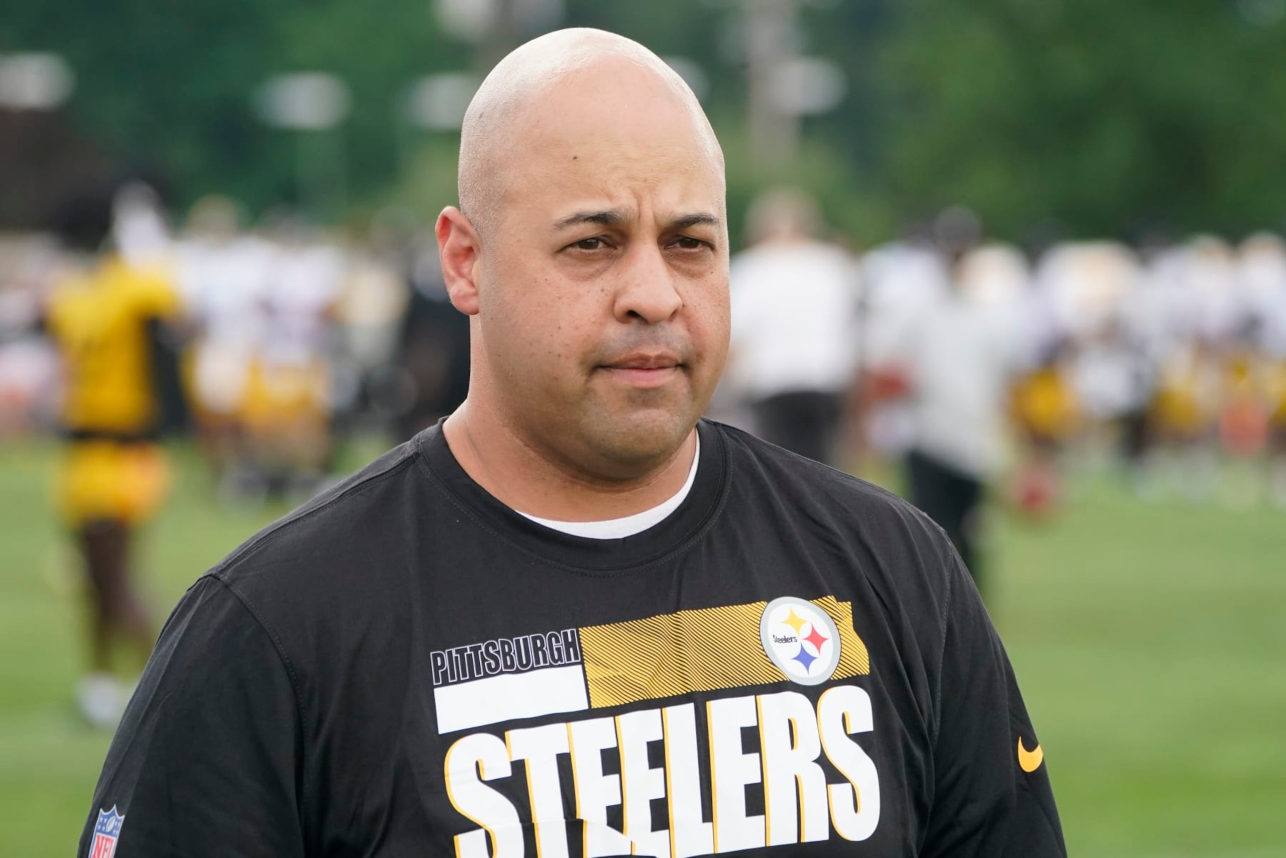 Pittsburgh Steelers General Manager Omar Khan watches the team go through drills during practice at NFL football training camp in the Latrobe Memorial Stadium in Latrobe, Pa., Monday, Aug. 8, 2022. (AP Photo/Keith Srakocic)