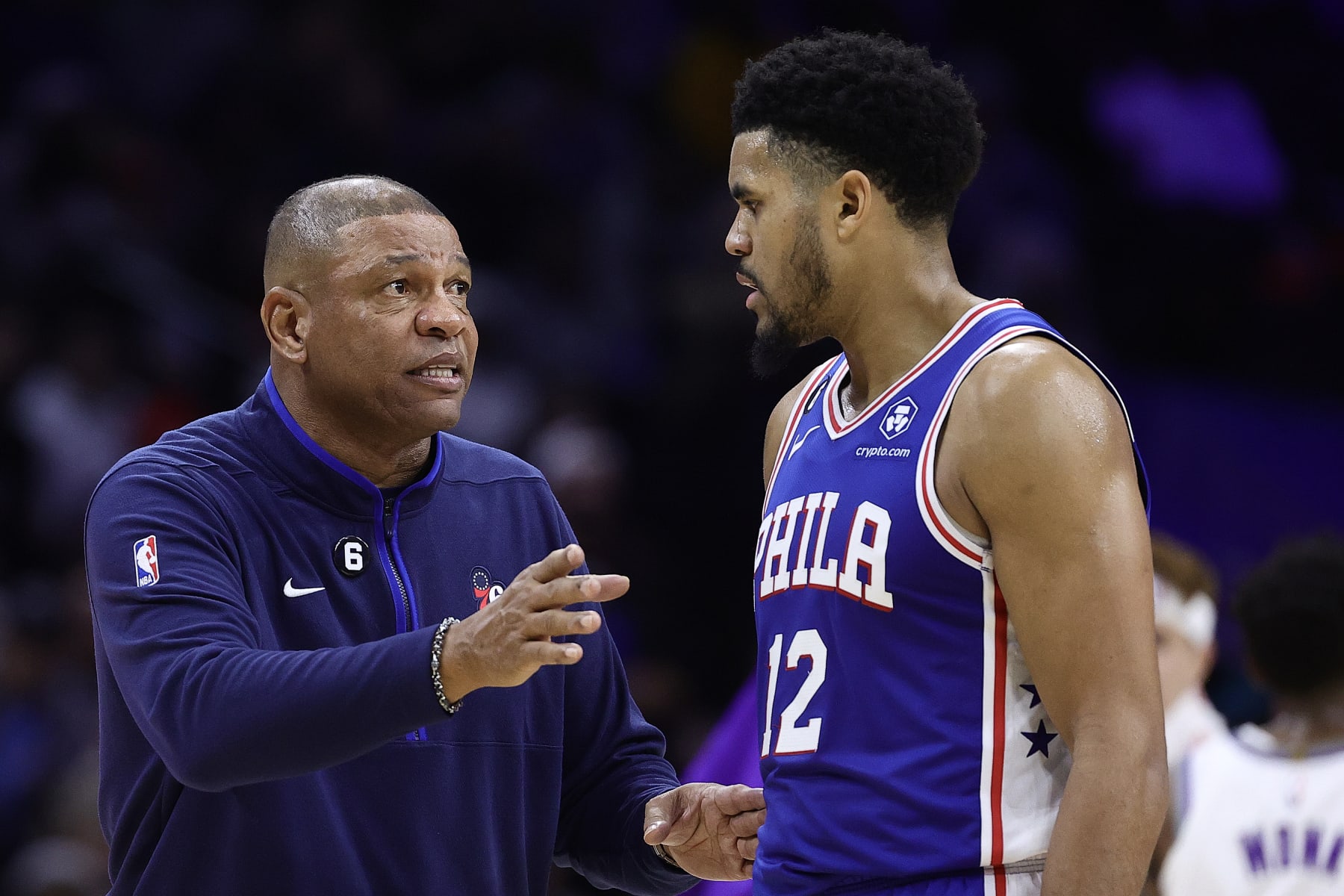 PHILADELPHIA, PENNSYLVANIA - DECEMBER 13: Head coach Doc Rivers and Tobias Harris #12 of the Philadelphia 76ers speak during the fourth quarter at Wells Fargo Center on December 13, 2022 in Philadelphia, Pennsylvania. NOTE TO USER: User expressly acknowledges and agrees that, by downloading and or using this photograph, User is consenting to the terms and conditions of the Getty Images License Agreement. (Photo by Tim Nwachukwu/Getty Images)