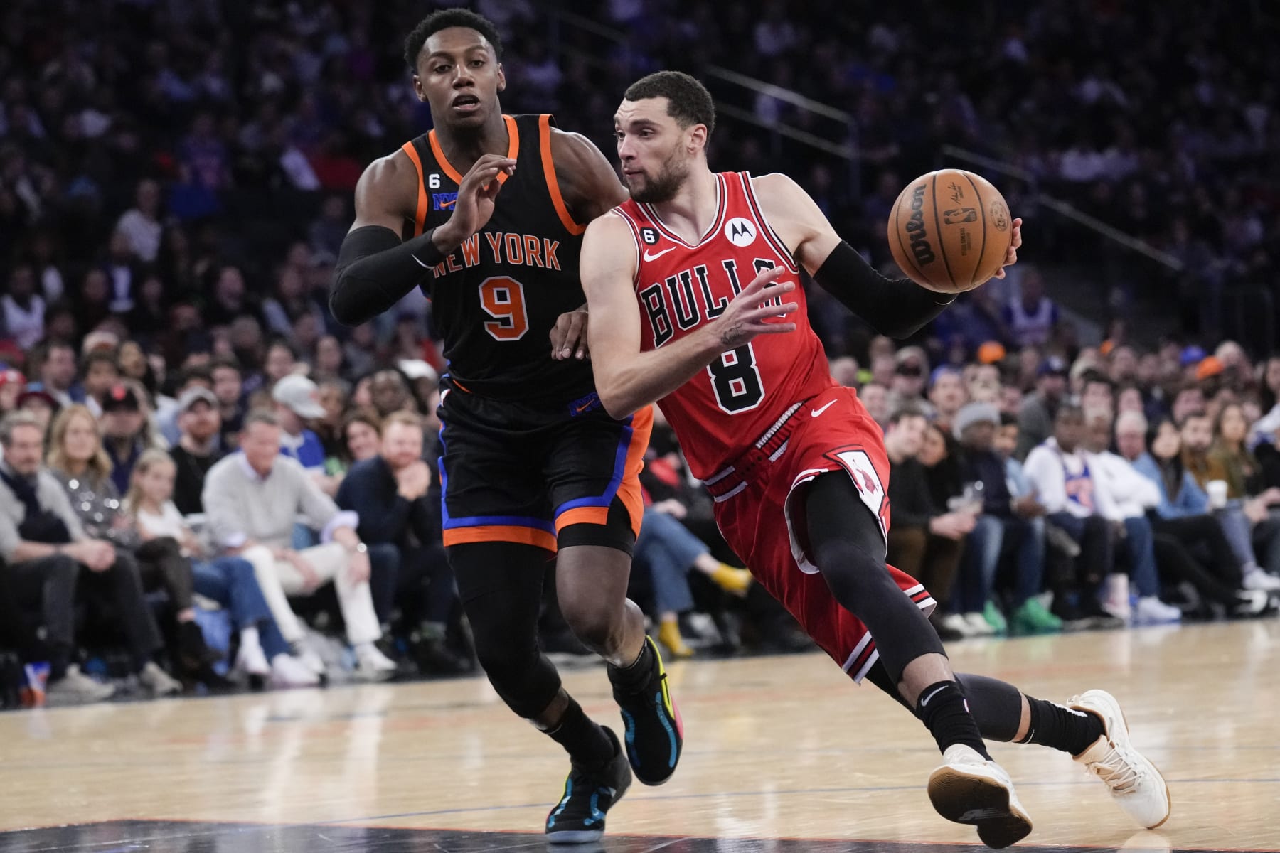 Chicago Bulls' Zach LaVine, right, moves past New York Knicks' RJ Barrett during the second half of an NBA basketball game, Friday, Dec. 23, 2022, in New York. (AP Photo/Seth Wenig)