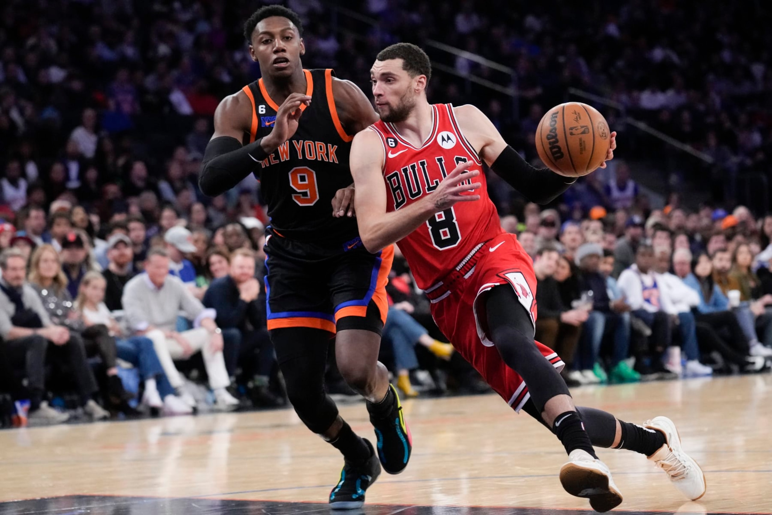 Chicago Bulls' Zach LaVine, right, moves past New York Knicks' RJ Barrett during the second half of an NBA basketball game, Friday, Dec. 23, 2022, in New York. (AP Photo/Seth Wenig) Chicago Bulls' Zach LaVine, right, moves past New York Knicks' RJ Barrett during the second half of an NBA basketball game, Friday, Dec. 23, 2022, in New York. (AP Photo/Seth Wenig)