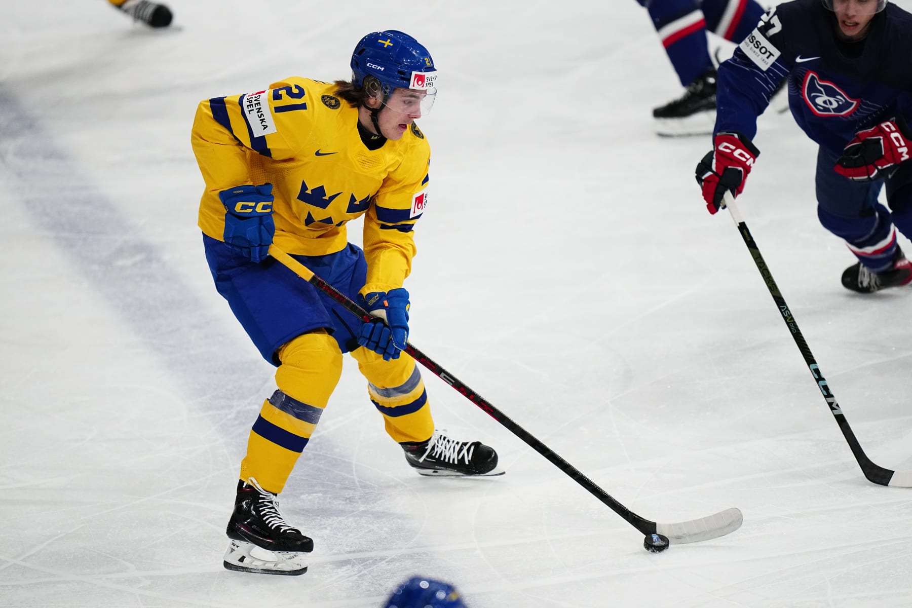 Sweden's Leo Carlsson controls the puck during the group A match between Sweden and France at the ice hockey world championship in Tampere, Finland, Saturday, May 20, 2023. (AP Photo/Pavel Golovkin)