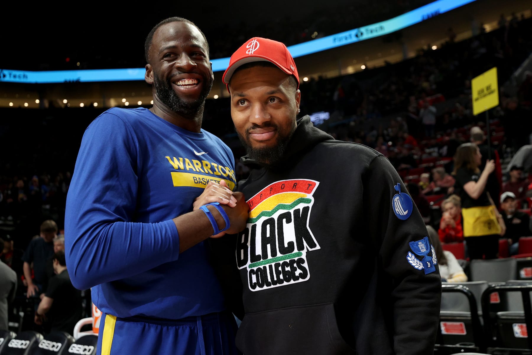 PORTLAND, OREGON - APRIL 09: Draymond Green #23 of the Golden State Warriors and Damian Lillard #0 of the Portland Trail Blazers greet each other before the game at Moda Center on April 09, 2023 in Portland, Oregon. NOTE TO USER: User expressly acknowledges and agrees that, by downloading and/or using this Photograph, user is consenting to the terms and conditions of the Getty Images License Agreement. (Photo by Steph Chambers/Getty Images)