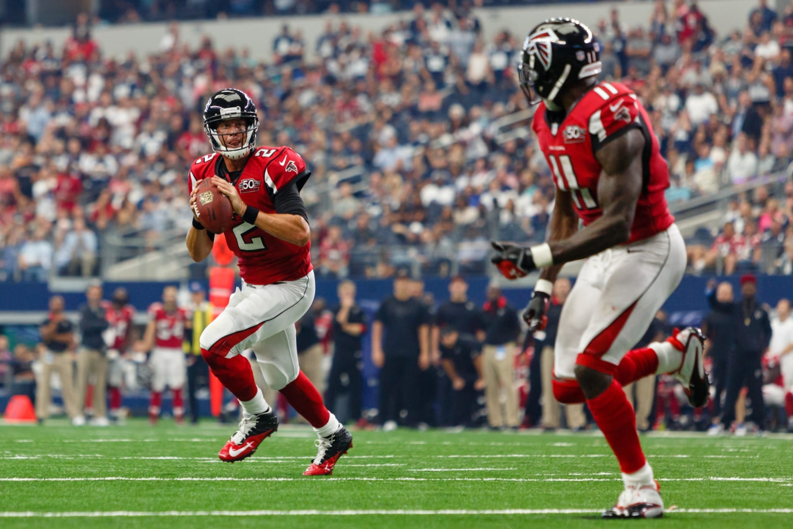 27 SEP 2015: Atlanta Falcons Quarterback Matt Ryan (2) [10265] rolls out for a touchdown pass to Wide Receiver Julio Jones (11) [16214] during the NFL game between the Atlanta Falcons and the Dallas Cowboys at AT&T Stadium in Arlington, TX. Atlanta defeats Dallas 39-28. (Photo by Andrew Dieb/Icon Sportswire) (Photo by Andrew Dieb/Icon Sportswire/Corbis/Icon Sportswire via Getty Images)