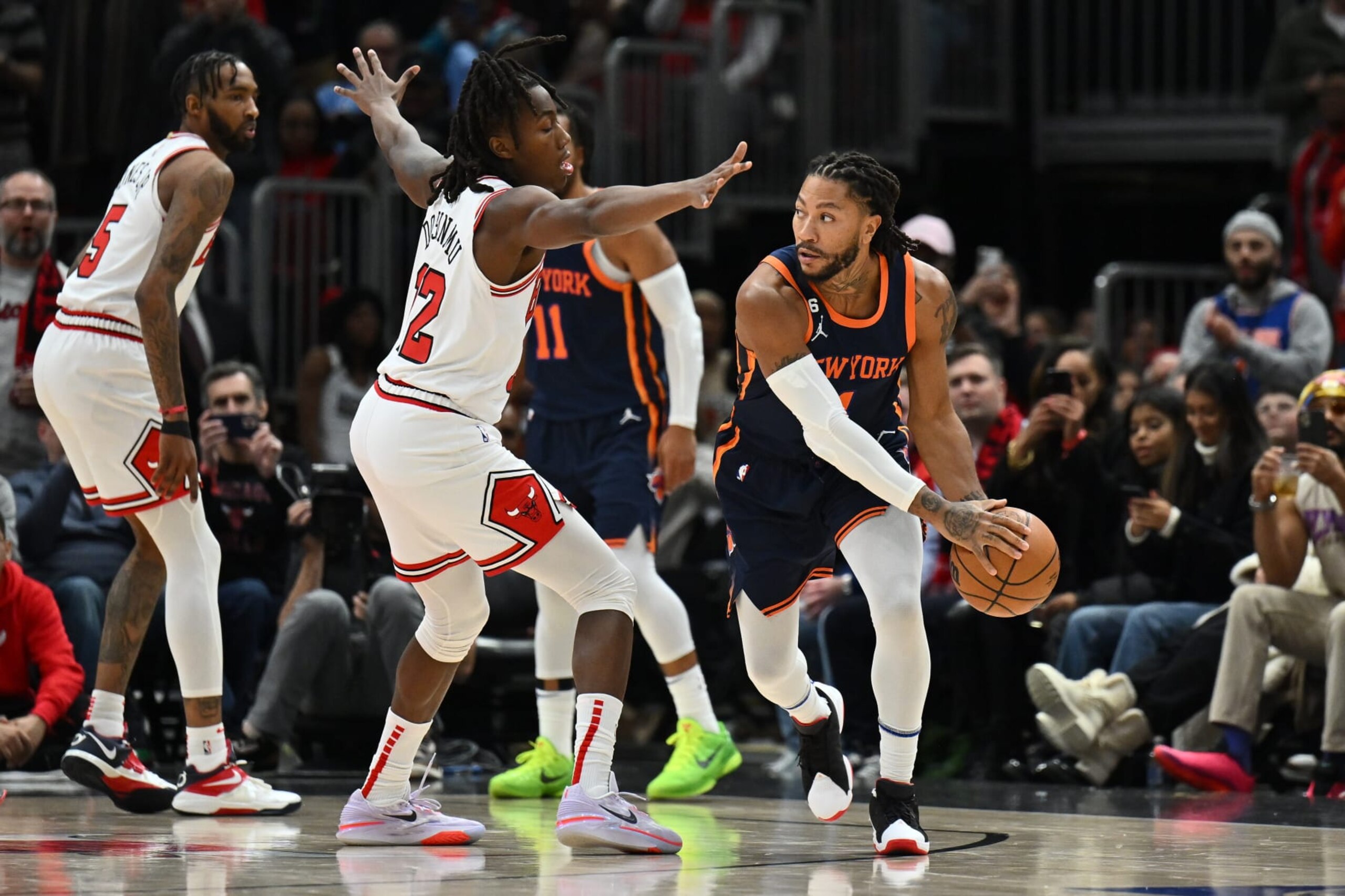 CHICAGO, ILLINOIS - DECEMBER 16: Derrick Rose #4 of the New York Knicks is guarded by Ayo Dosunmu #12 of the Chicago Bulls in the second half on December 16, 2022 at the United Center in Chicago, Illinois. New York defeated Chicago 114-91. NOTE TO USER: User expressly acknowledges and agrees that, by downloading and or using this photograph, User is consenting to the terms and conditions of the Getty Images License Agreement. (Photo by Jamie Sabau/Getty Images)