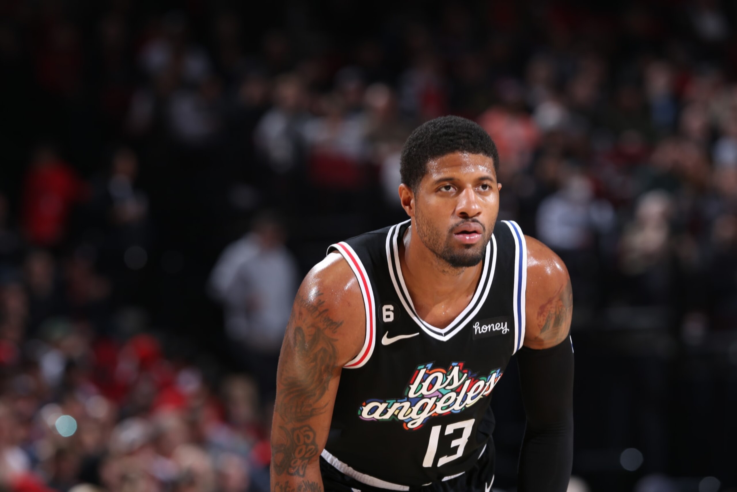 PORTLAND, OR - MARCH 19: Paul George #13 of the LA Clippers looks on during the game against the Portland Trail Blazers on March 19, 2023 at the Moda Center Arena in Portland, Oregon. NOTE TO USER: User expressly acknowledges and agrees that, by downloading and or using this photograph, user is consenting to the terms and conditions of the Getty Images License Agreement. Mandatory Copyright Notice: Copyright 2023 NBAE (Photo by Sam Forencich/NBAE via Getty Images) PORTLAND, OR - MARCH 19: Paul George #13 of the LA Clippers looks on during the game against the Portland Trail Blazers on March 19, 2023 at the Moda Center Arena in Portland, Oregon. NOTE TO USER: User expressly acknowledges and agrees that, by downloading and or using this photograph, user is consenting to the terms and conditions of the Getty Images License Agreement. Mandatory Copyright Notice: Copyright 2023 NBAE (Photo by Sam Forencich/NBAE via Getty Images)