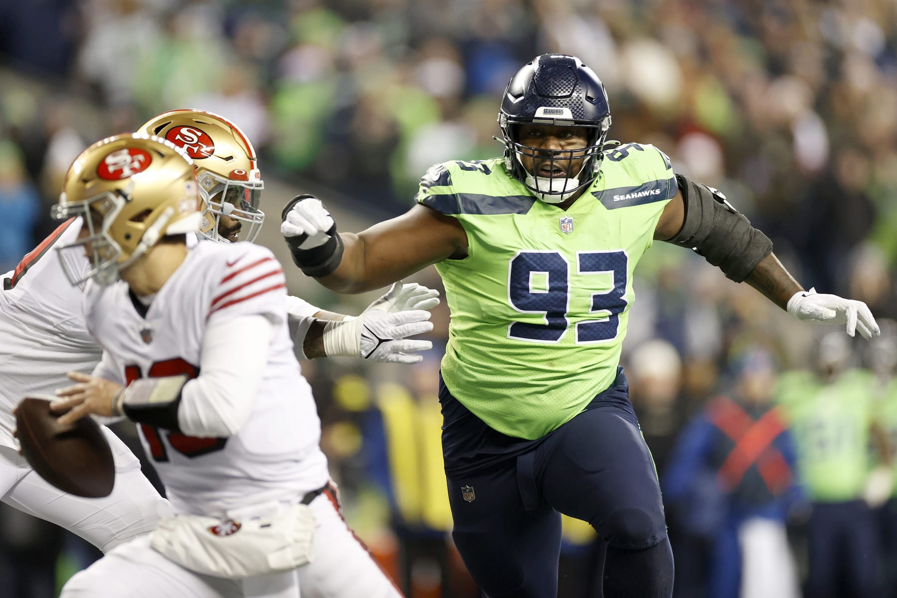 SEATTLE, WASHINGTON - DECEMBER 15: Shelby Harris #93 of the Seattle Seahawks pressures Brock Purdy #13 of the San Francisco 49ers during the fourth quarter at Lumen Field on December 15, 2022 in Seattle, Washington. (Photo by Steph Chambers/Getty Images)