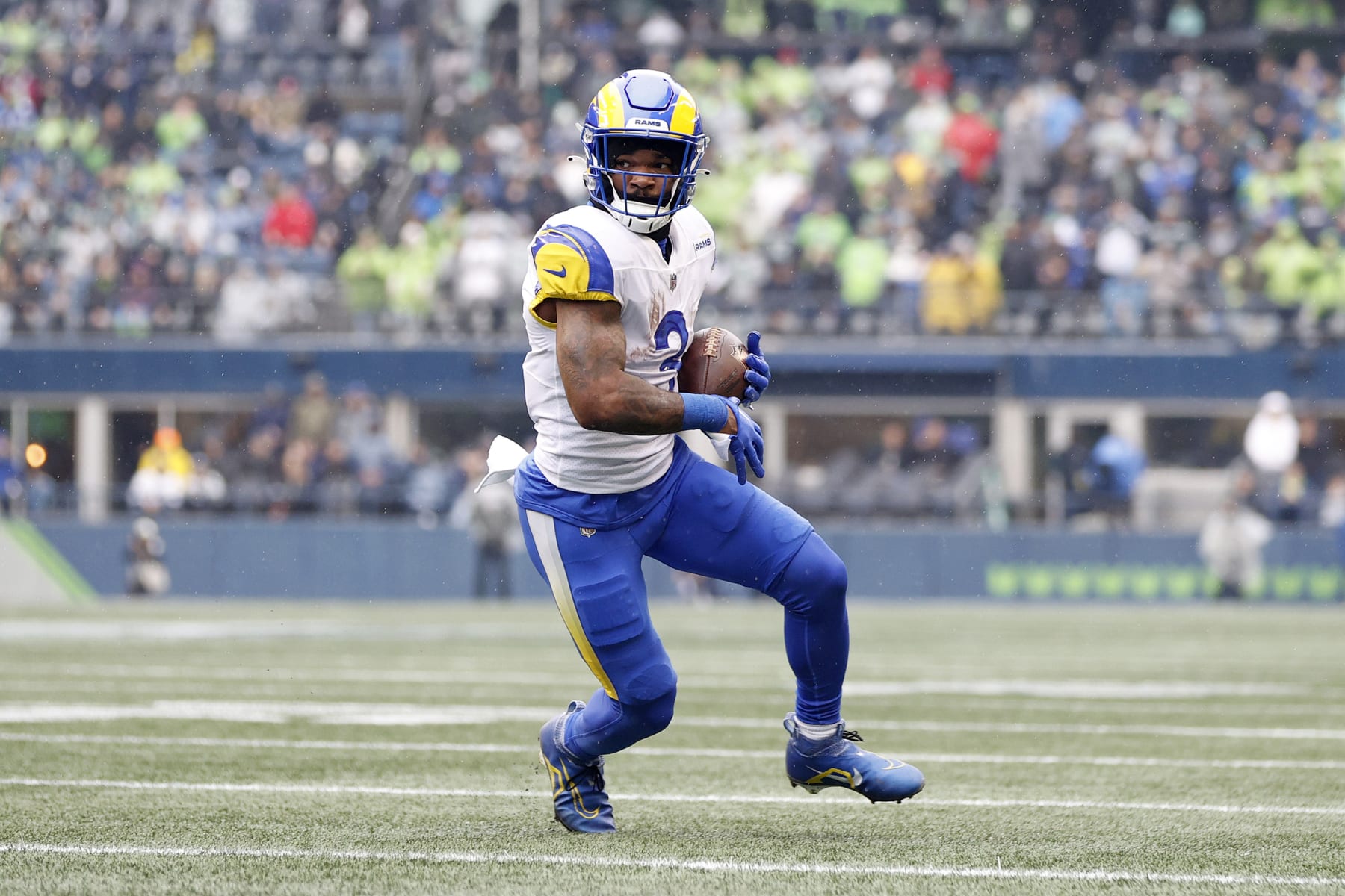 SEATTLE, WASHINGTON - JANUARY 08: Cam Akers #3 of the Los Angeles Rams carries the ball against the Seattle Seahawks during the first quarter at Lumen Field on January 08, 2023 in Seattle, Washington. (Photo by Steph Chambers/Getty Images)