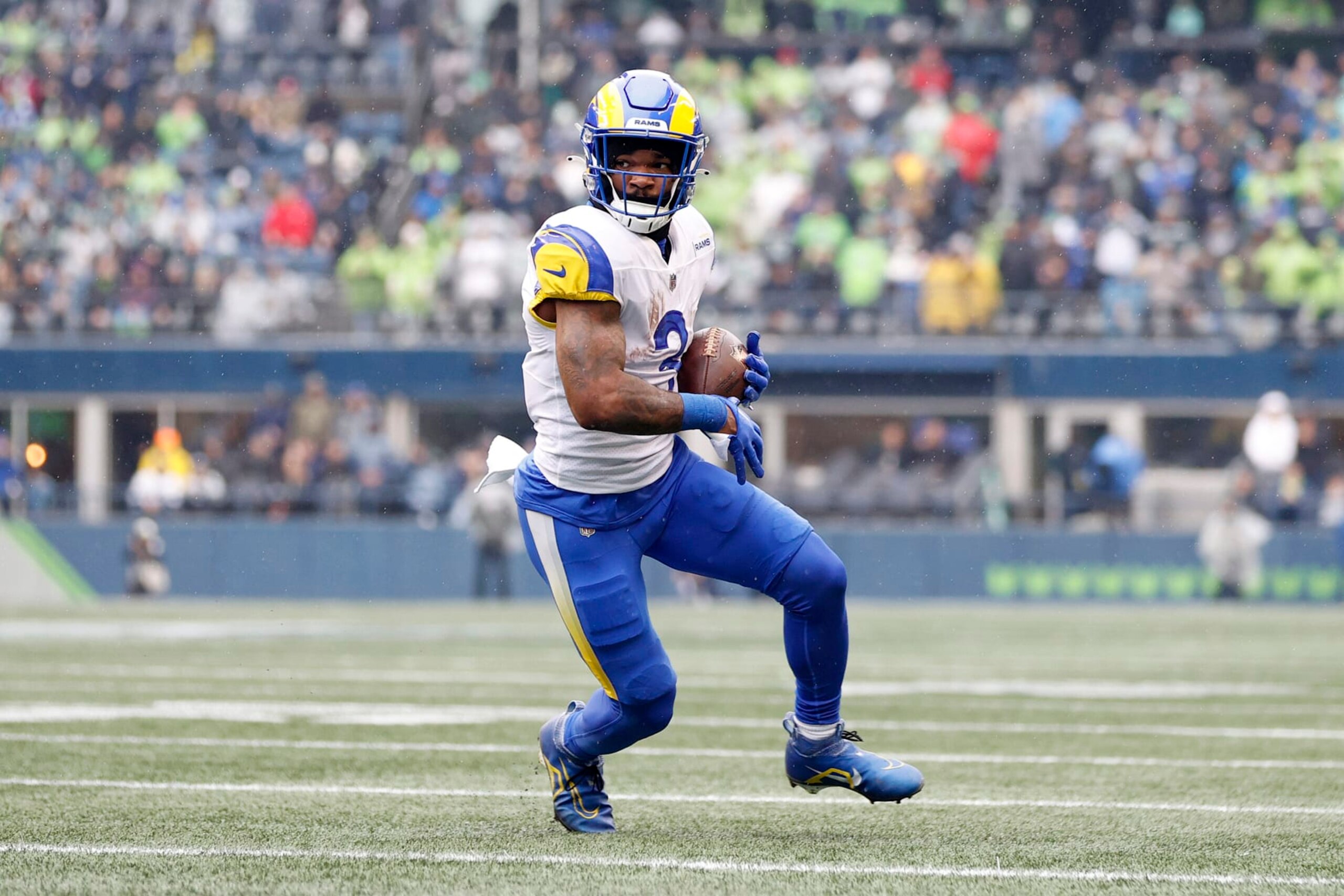 SEATTLE, WASHINGTON - JANUARY 08: Cam Akers #3 of the Los Angeles Rams carries the ball against the Seattle Seahawks during the first quarter at Lumen Field on January 08, 2023 in Seattle, Washington. (Photo by Steph Chambers/Getty Images)
