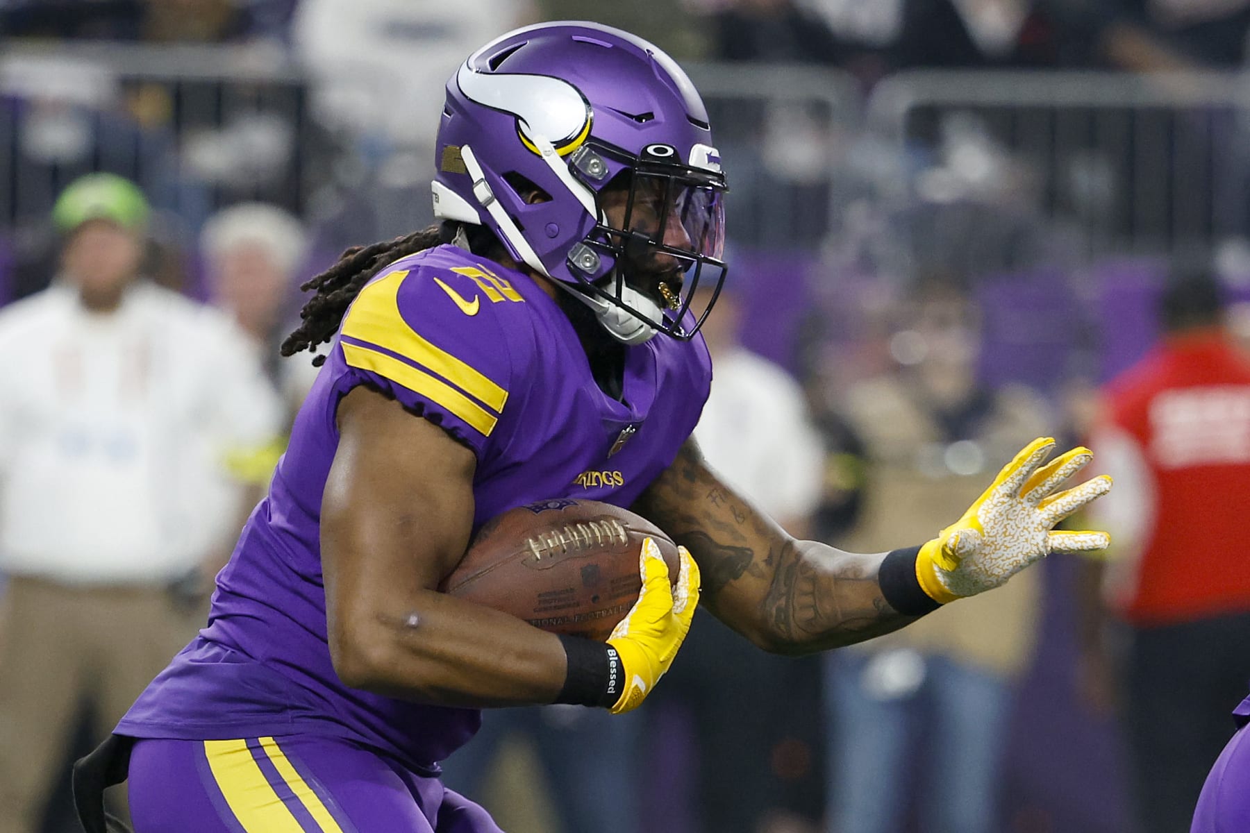 MINNEAPOLIS, MINNESOTA - NOVEMBER 24: Alexander Mattison #2 of the Minnesota Vikings carries the ball against the New England Patriots during the first half at U.S. Bank Stadium on November 24, 2022 in Minneapolis, Minnesota. (Photo by David Berding/Getty Images)