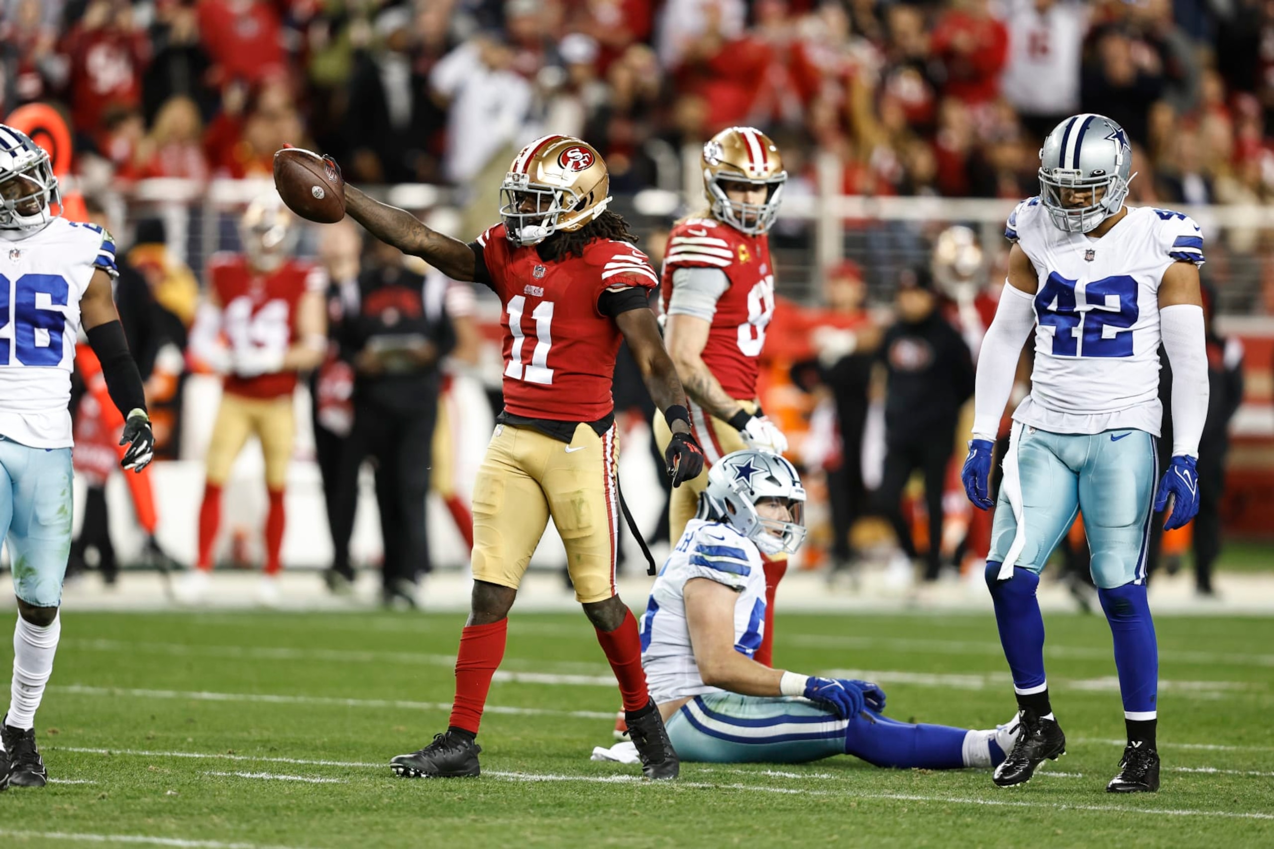SANTA CLARA, CALIFORNIA - JANUARY 22: Brandon Aiyuk #11 of the San Francisco 49ers signals for a first down during an NFL divisional round playoff football game between the San Francisco 49ers and the Dallas Cowboys at Levi's Stadium on January 22, 2023 in Santa Clara, California. (Photo by Michael Owens/Getty Images)