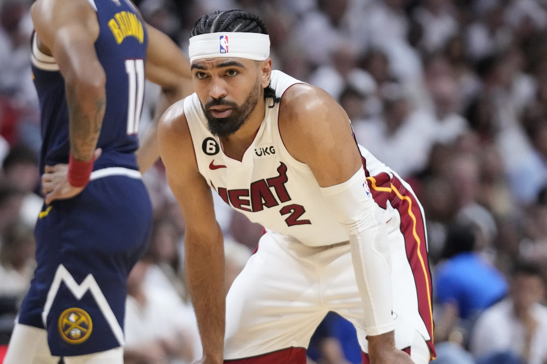 Miami Heat guard Gabe Vincent (2) waits for play to resume during the first half of Game 4 of the basketball NBA Finals against the Denver Nuggets, Friday, June 9, 2023, in Miami. (AP Photo/Wilfredo Lee)