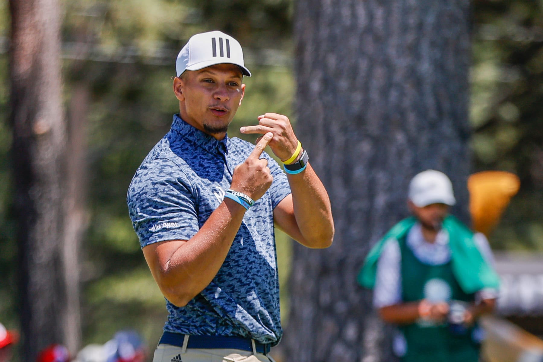STATELINE, NV - JULY 10: NFL quarterback Patrick Mahomes shows his ring finger to fans near the 17th putting green during the final round of the American Century Championship at Edgewood Tahoe Golf Course on July 10, 2022 in Stateline, Nevada. (Photo by Isaiah Vazquez/Clarkson Creative/Getty Images)