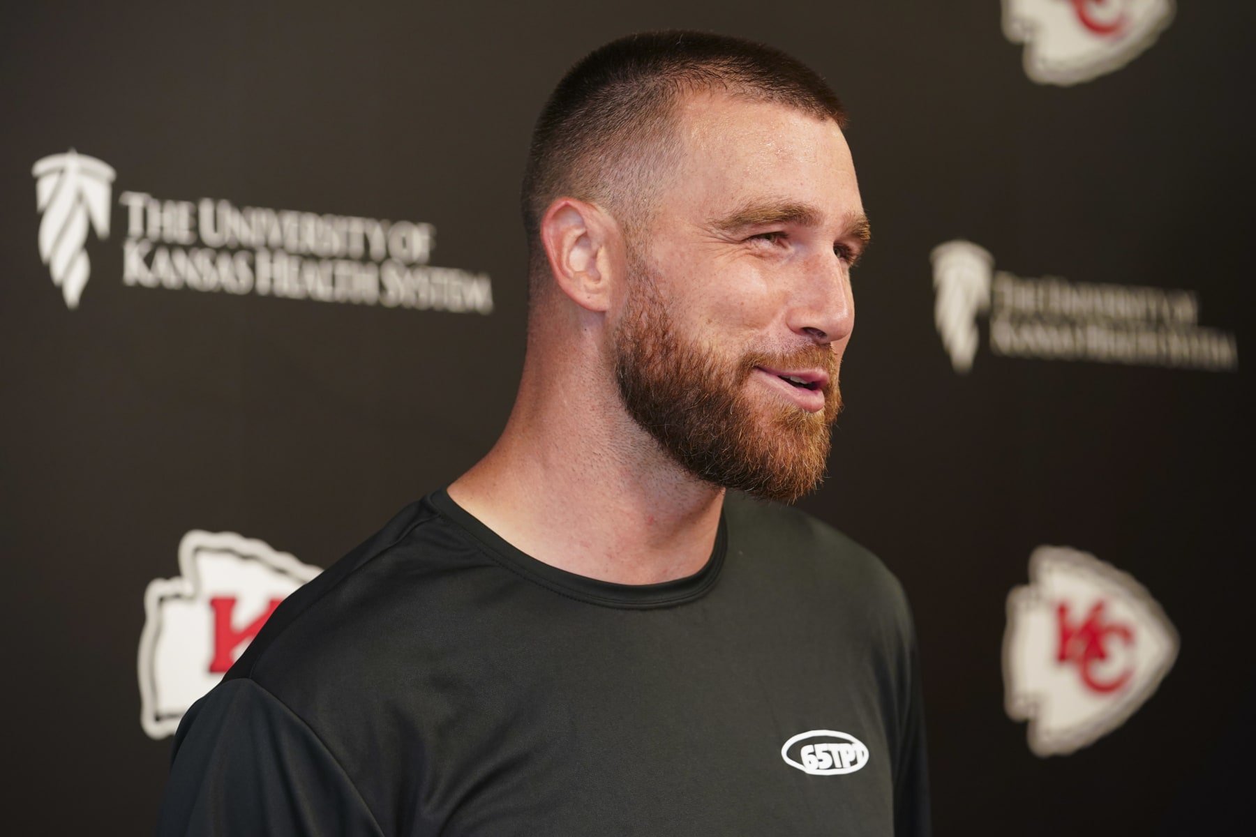 KANSAS CITY, MISSOURI - JUNE 13: Travis Kelce #87 of the Kansas City Chiefs speaks to the press during Chiefs Mini Camp on June 13, 2023 at Arrowhead Stadium in Kansas City, Missouri. (Photo by Kyle Rivas/Getty Images)