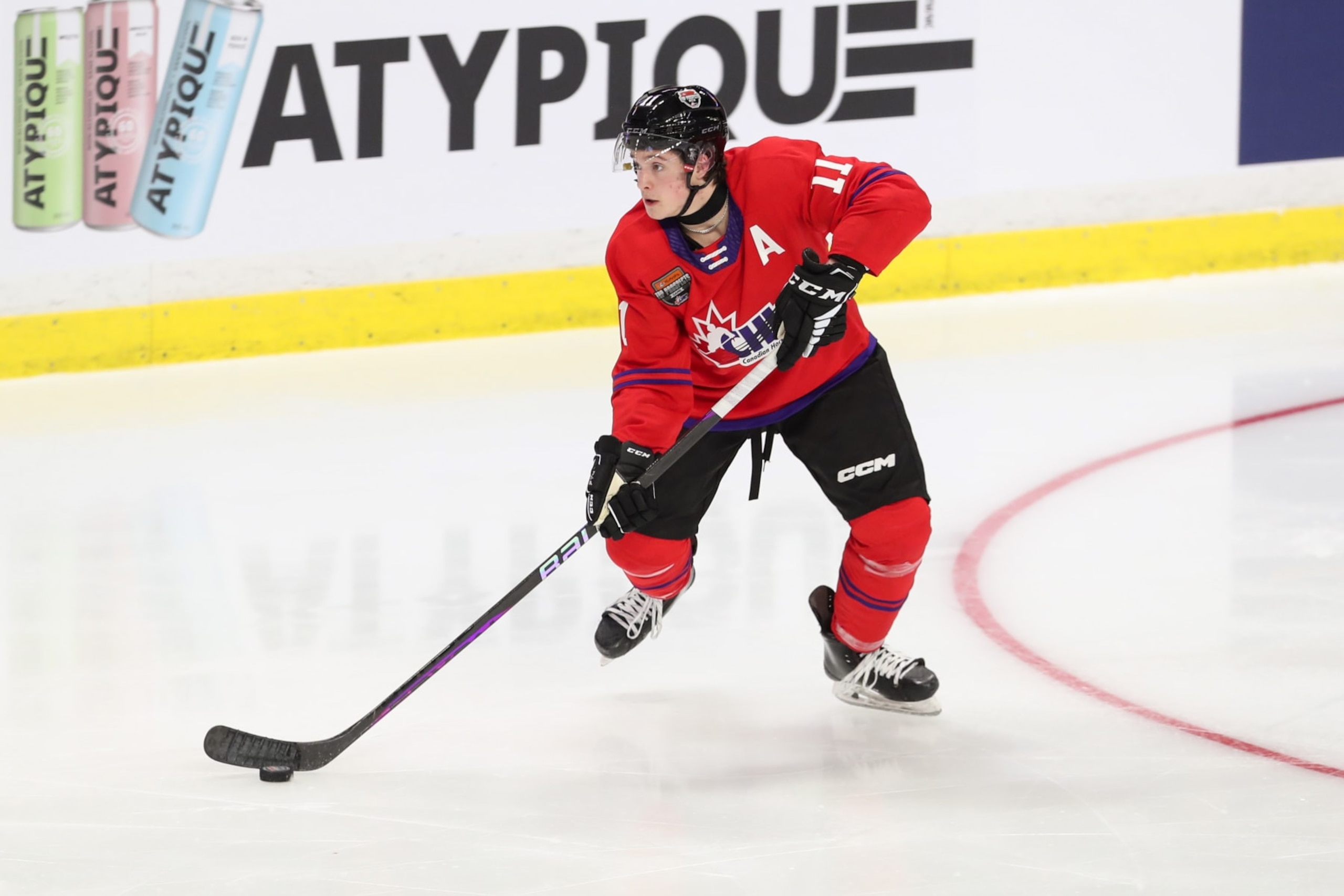 LANGLEY, BRITISH COLUMBIA - JANUARY 25: Defenceman Beau Akey #11 of the Barrie Colts moves the puck for Team Red during the 2023 Kubota CHL Top Prospects Game at the Langley Events Centre on January 25, 2023 in Langley, British Columbia. (Photo by Dennis Pajot/Getty Images)