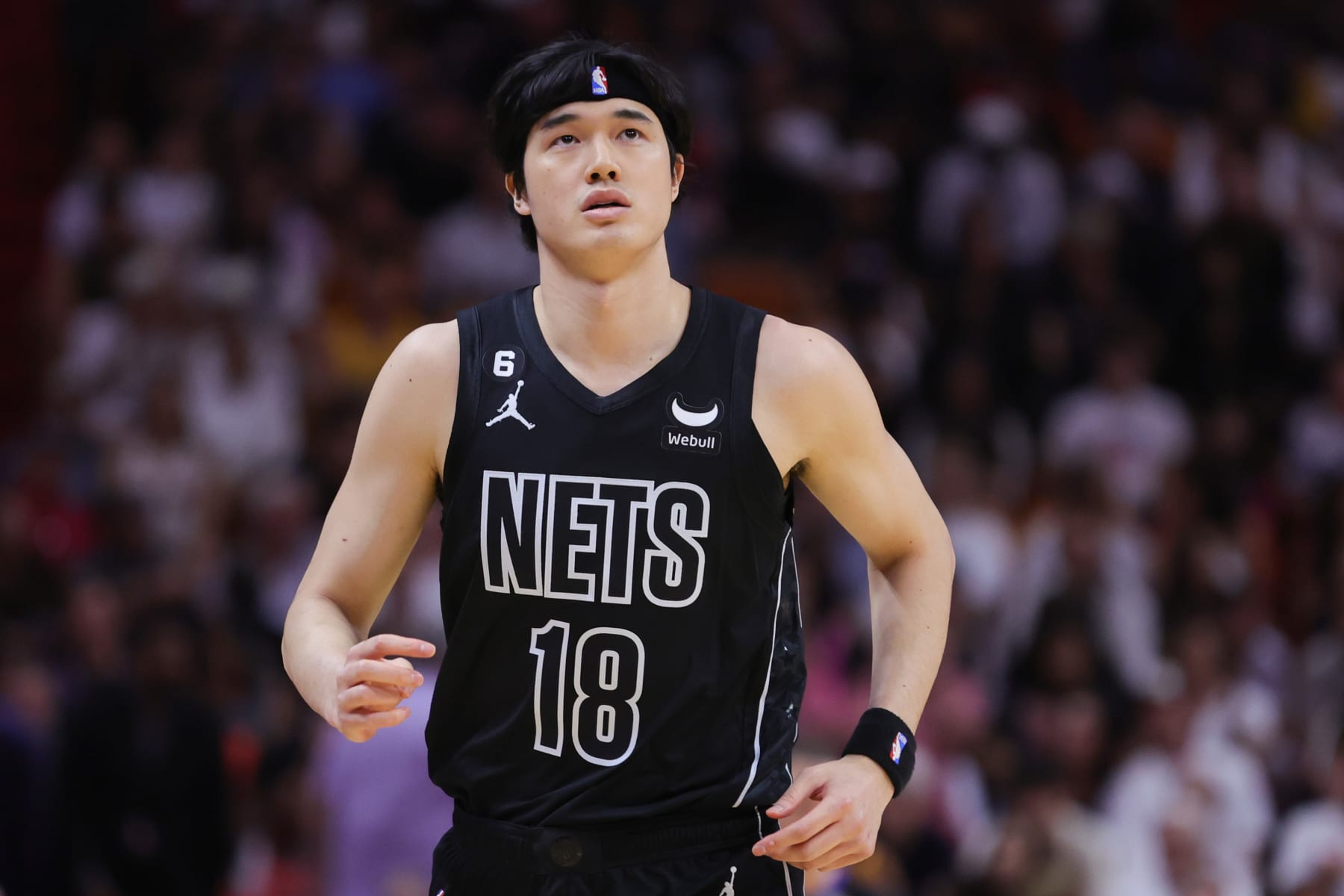 MIAMI, FLORIDA - MARCH 25: Yuta Watanabe #18 of the Brooklyn Nets looks on against the Miami Heat during the first quarter at Miami-Dade Arena on March 25, 2023 in Miami, Florida. NOTE TO USER: User expressly acknowledges and agrees that, by downloading and or using this photograph, User is consenting to the terms and conditions of the Getty Images License Agreement.  (Photo by Megan Briggs/Getty Images)