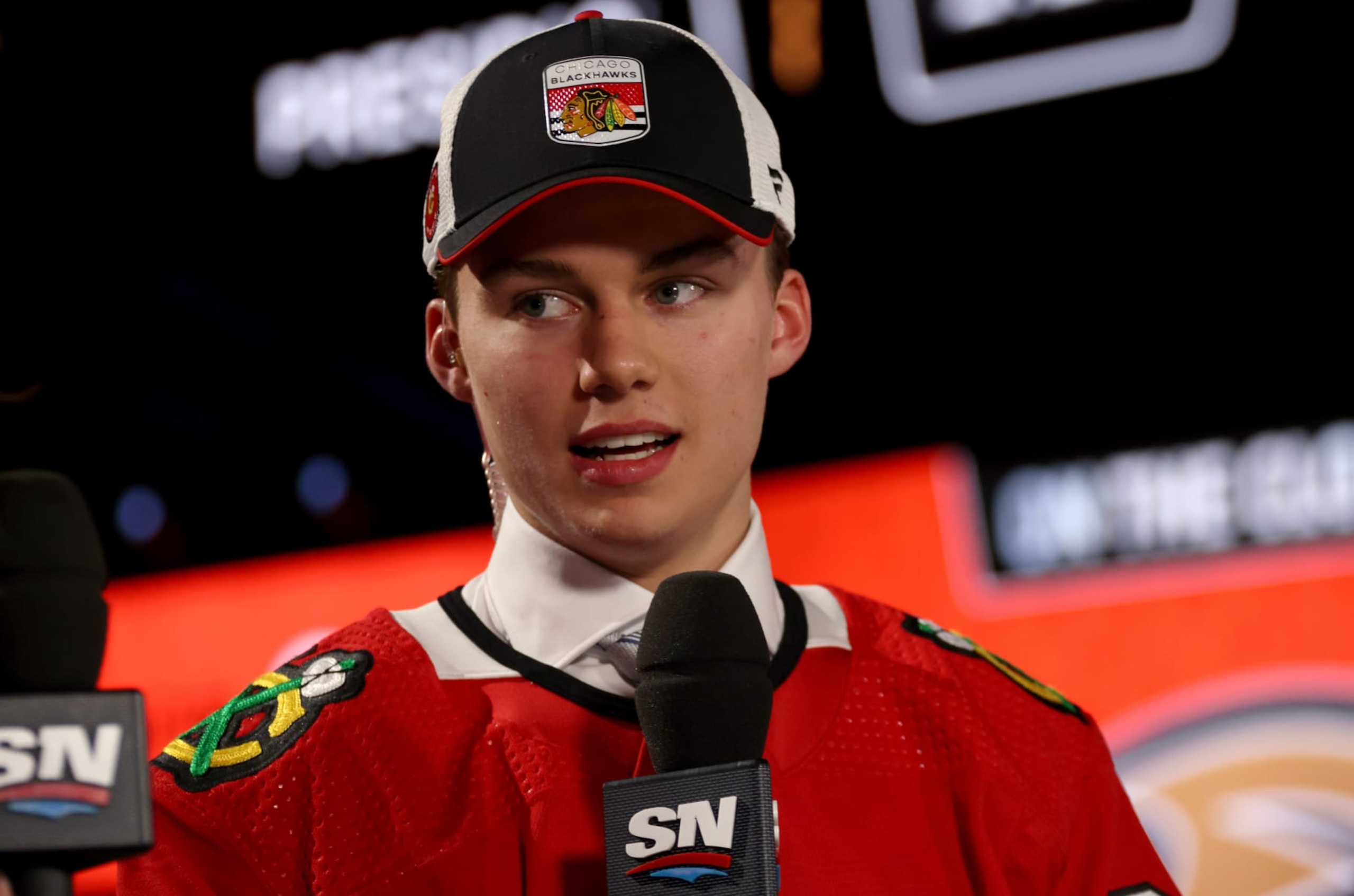 NASHVILLE, TENNESSEE - JUNE 28: Connor Bedard speaks during an interview after being selected first overall by the Chicago Blackhawks during the 2023 Upper Deck NHL Draft - Round One at Bridgestone Arena on June 28, 2023 in Nashville, Tennessee. (Photo by Dave Sandford/NHLI via Getty Images) NASHVILLE, TENNESSEE - JUNE 28: Connor Bedard speaks during an interview after being selected first overall by the Chicago Blackhawks during the 2023 Upper Deck NHL Draft - Round One at Bridgestone Arena on June 28, 2023 in Nashville, Tennessee. (Photo by Dave Sandford/NHLI via Getty Images)
