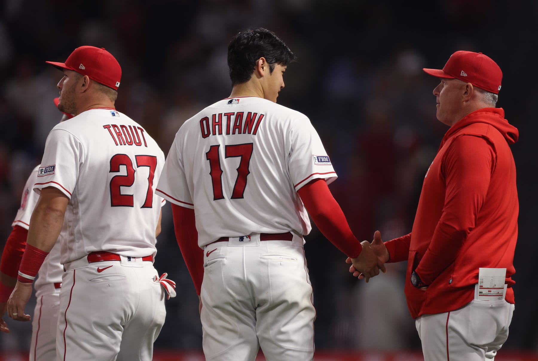 ANAHEIM, CALIFORNIA - JUNE 27: Shohei Ohtani #17 of the Los Angeles Angels gets a handshake from Manager Phil Nevin #88 after a 4-2 win over the Chicago White Sox at Angel Stadium of Anaheim on June 27, 2023 in Anaheim, California. (Photo by Harry How/Getty Images)