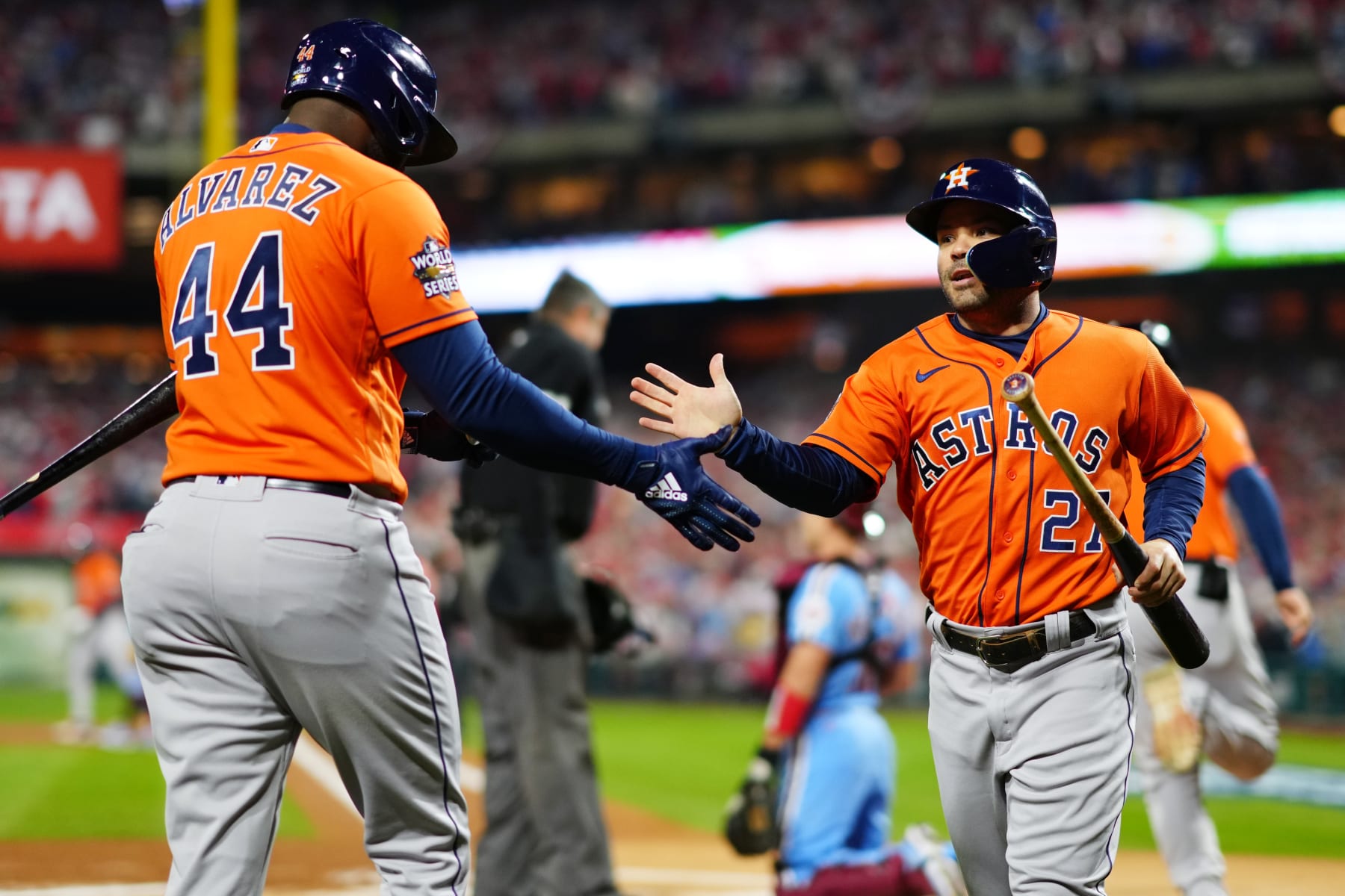 PHILADELPHIA, PA - NOVEMBER 03:  Jose Altuve #27 of the Houston Astros is congratulated by Yordan Alvarez #44 after scoring a run in the first inning during Game 5 of the 2022 World Series between the Houston Astros and the Philadelphia Phillies at Citizens Bank Park on Thursday, November 3, 2022 in Philadelphia, Pennsylvania. (Photo by Daniel Shirey/MLB Photos via Getty Images)