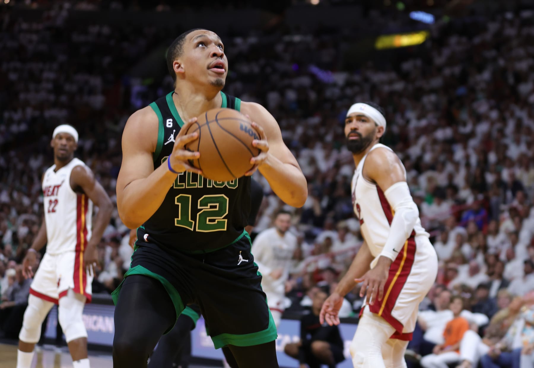MIAMI, FLORIDA - MAY 21: Grant Williams #12 of the Boston Celtics drives to the basket during the second quarter against the Miami Heat in game three of the Eastern Conference Finals at Kaseya Center on May 21, 2023 in Miami, Florida. NOTE TO USER: User expressly acknowledges and agrees that, by downloading and or using this photograph, User is consenting to the terms and conditions of the Getty Images License Agreement. (Photo by Megan Briggs/Getty Images)
