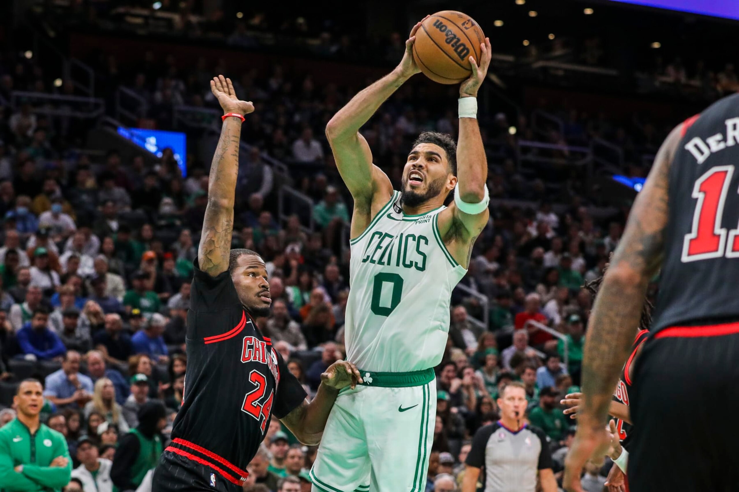 Boston, MA - November 4: Boston Celtics SF Jayson Tatum tries to shoot the ball while Chicago Bulls SF Javonte Green keeps a hand on his hip. The Celtics beat the Chicago Bulls 123-119. (Photo by Erin Clark/The Boston Globe via Getty Images)