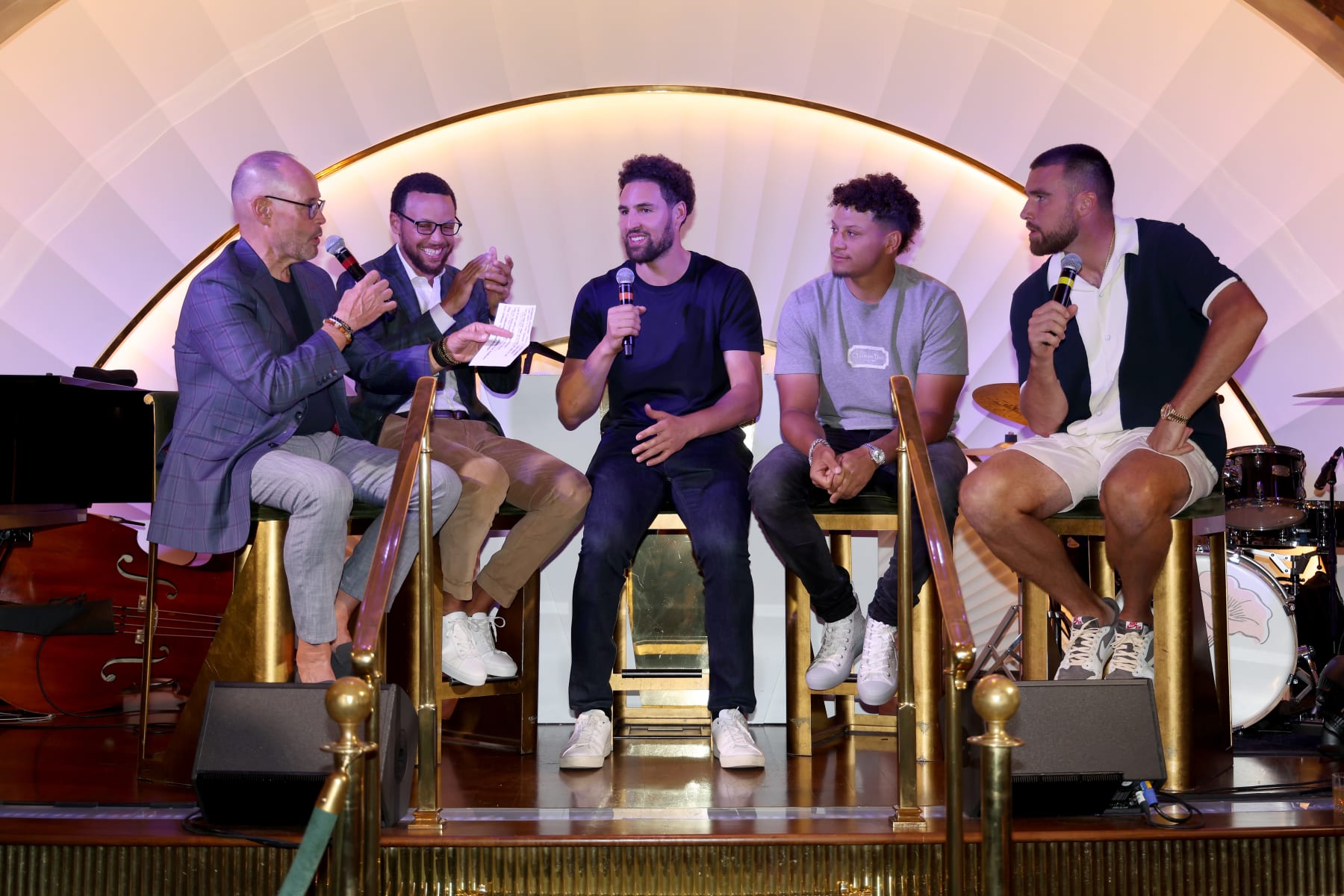 LAS VEGAS, NEVADA - JUNE 28: (L-R) TNT commentator Ernie Johnson speaks with Stephen Curry and Klay Thompson of the Golden State Warriors and Patrick Mahomes and Travis Kelce of the Kansas City Chiefs at a welcome reception for Capital One's The Match VII at Wynn Golf Club on June 28, 2023 in Las Vegas, Nevada. (Photo by Ezra Shaw/Getty Images for The Match)