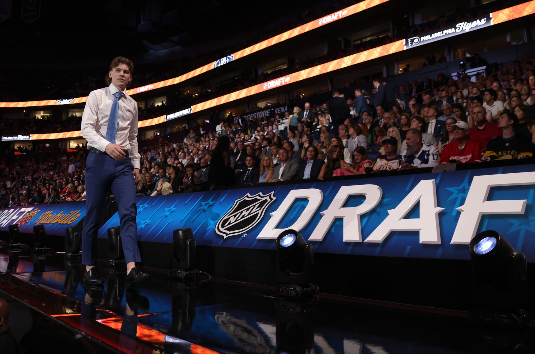NASHVILLE, TENNESSEE - JUNE 28: Oliver Bonk walks to the stage after being selected 22nd overall by the Philadelphia Flyers during the 2023 Upper Deck NHL Draft - Round One at Bridgestone Arena on June 28, 2023 in Nashville, Tennessee. (Photo by Dave Sandford/NHLI via Getty Images)