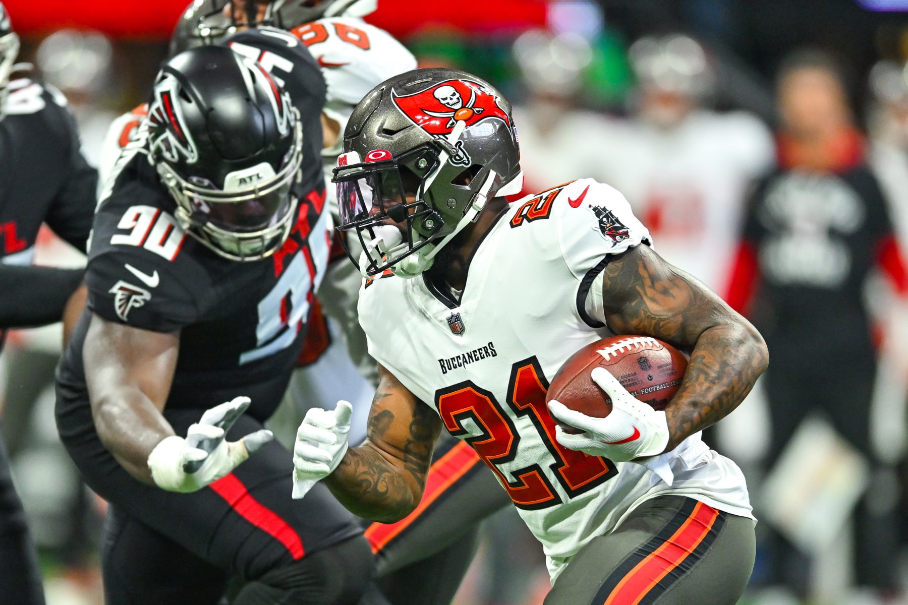 ATLANTA, GA  JANUARY 08:  Tampa Bay running back Ke'Shawn Vaughn (21) runs the ball during the NFL game between the Tampa Bay Buccaneers and the Atlanta Falcons on January 8th, 2023 at Mercedes-Benz Stadium in Atlanta, GA.  (Photo by Rich von Biberstein/Icon Sportswire via Getty Images)