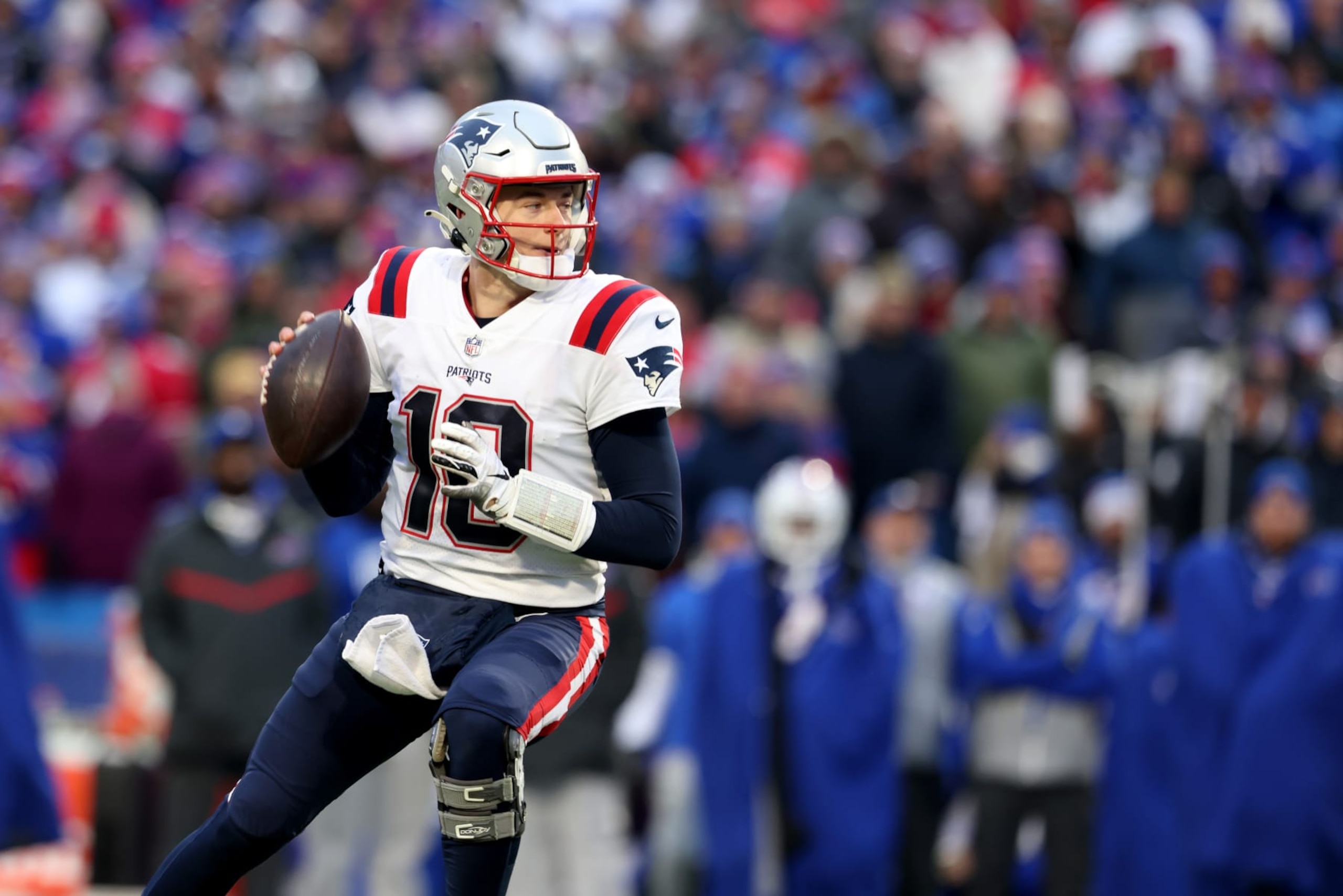 ORCHARD PARK, NEW YORK - JANUARY 08: Mac Jones #10 of the New England Patriots looks to pass during the fourth quarter against the Buffalo Bills at Highmark Stadium on January 08, 2023 in Orchard Park, New York. (Photo by Bryan Bennett/Getty Images)