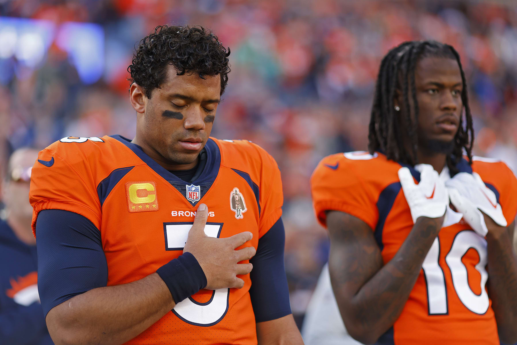 DENVER, COLORADO - JANUARY 08: Russell Wilson #3 of the Denver Broncos and Jerry Jeudy #10 of the Denver Broncos during the National Anthem prior to their game against the Los Angeles Chargers at Empower Field At Mile High on January 08, 2023 in Denver, Colorado. (Photo by Justin Edmonds/Getty Images)