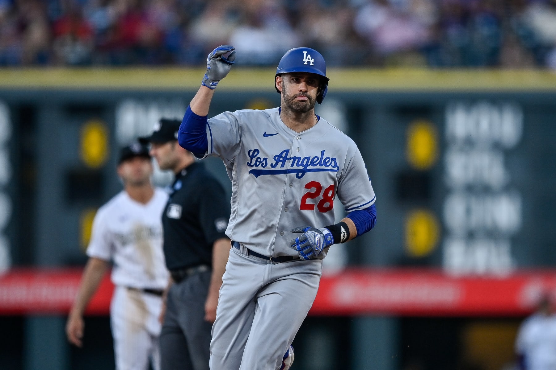 DENVER, CO - JUNE 27: Los Angeles Dodgers designated hitter J.D. Martinez #28 rounds the bases after hitting a sixth inning solo homerun during a game between the Los Angeles Dodgers and the Colorado Rockies at Coors Field on June 27, 2023 in Denver, Colorado. (Photo by Dustin Bradford/Icon Sportswire via Getty Images)