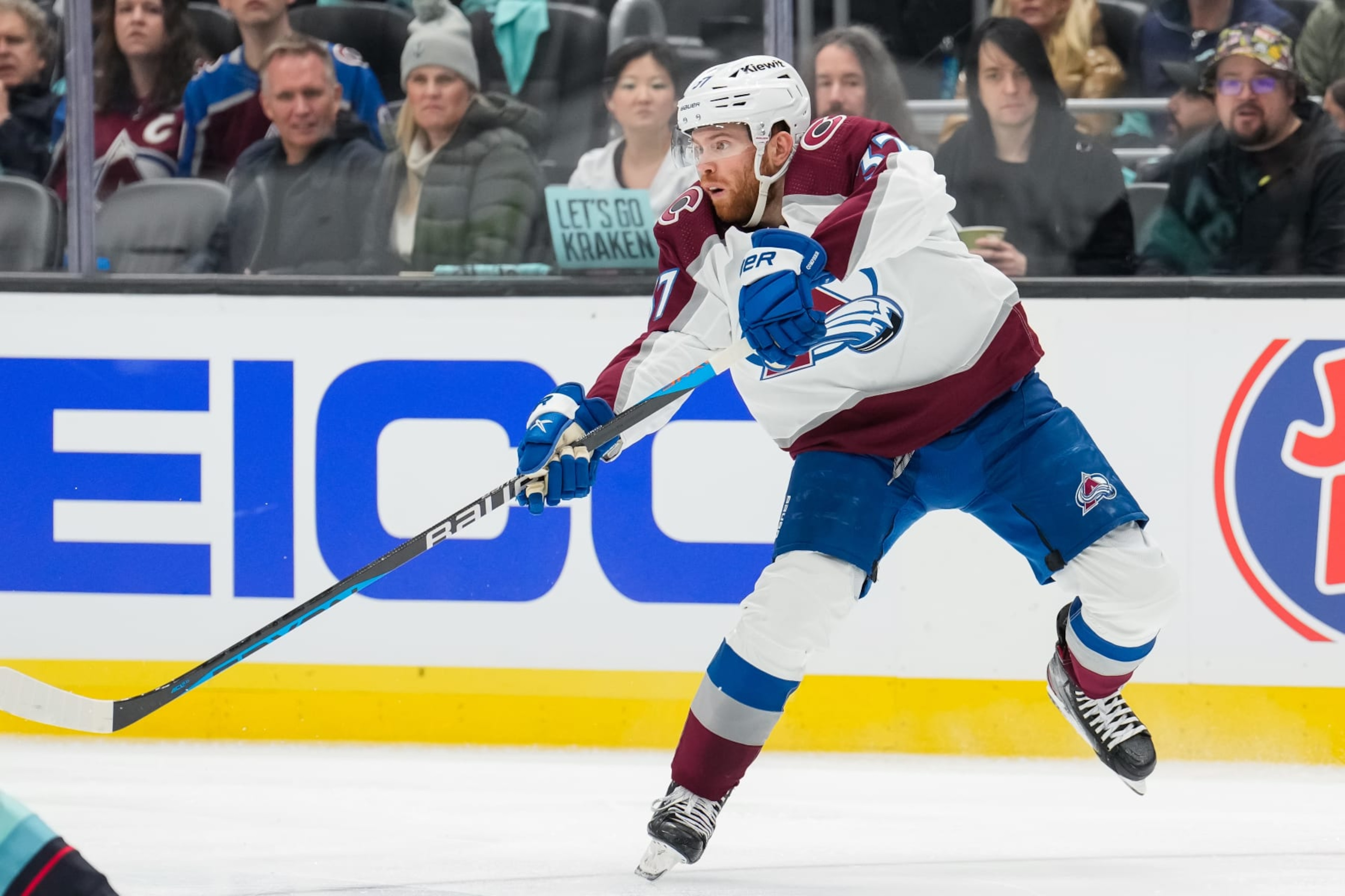 SEATTLE, WASHINGTON - APRIL 22: J.T. Compher #37 of the Colorado Avalanche passes the puck during the second period against the Seattle Kraken in Game Three of the First Round of the 2023 Stanley Cup Playoffs at Climate Pledge Arena on April 22, 2023 in Seattle, Washington. (Photo by Christopher Mast/2023 NHLI)