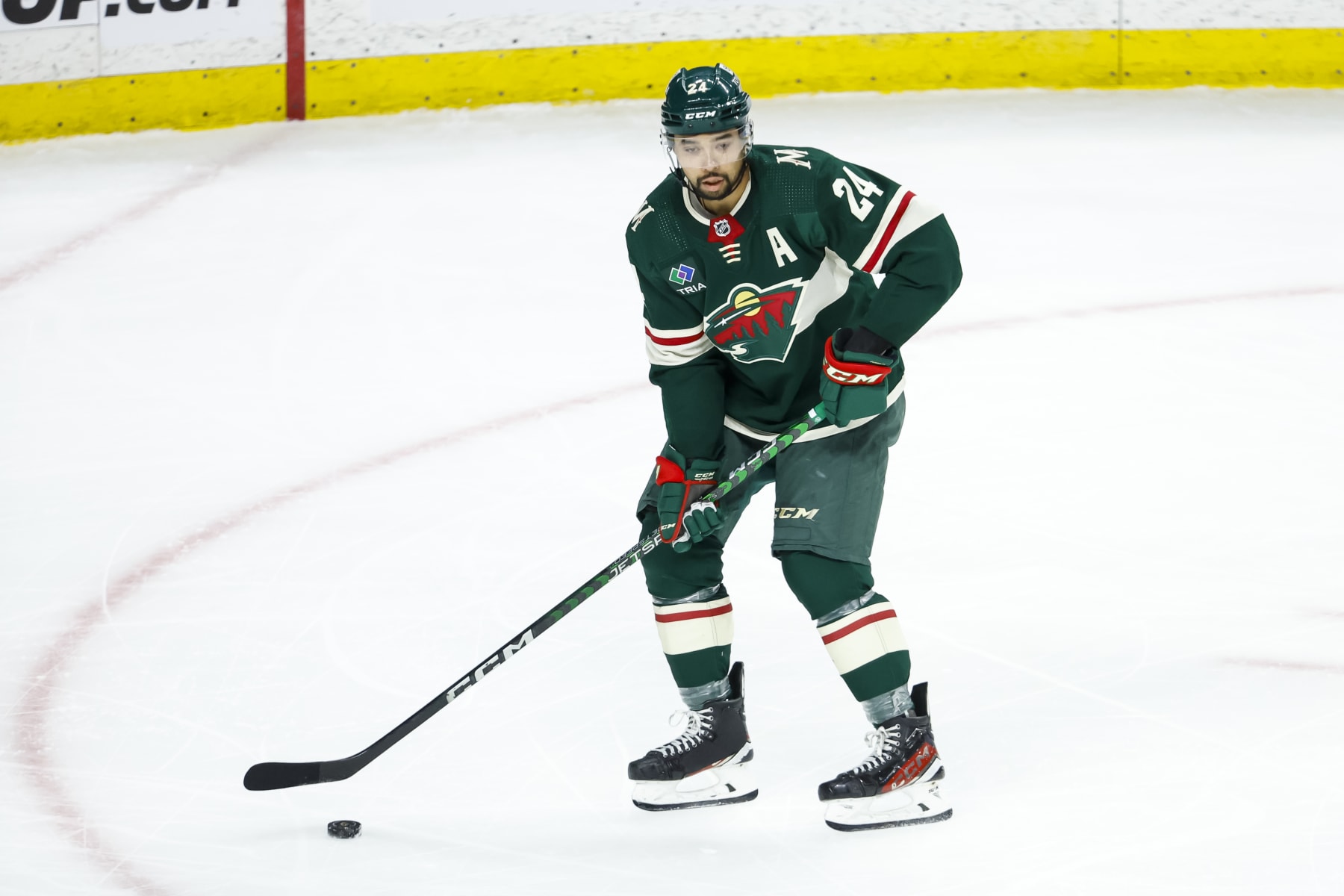 ST PAUL, MN - APRIL 23: Matt Dumba #24 of the Minnesota Wild skates with the puck against the Dallas Stars in the third period of Game Four of the First Round of the 2023 Stanley Cup Playoffs at Xcel Energy Center on April 23, 2023 in St Paul, Minnesota. The Stars defeated the Wild 3-2 to tie the series 2-2. (Photo by David Berding/Getty Images)